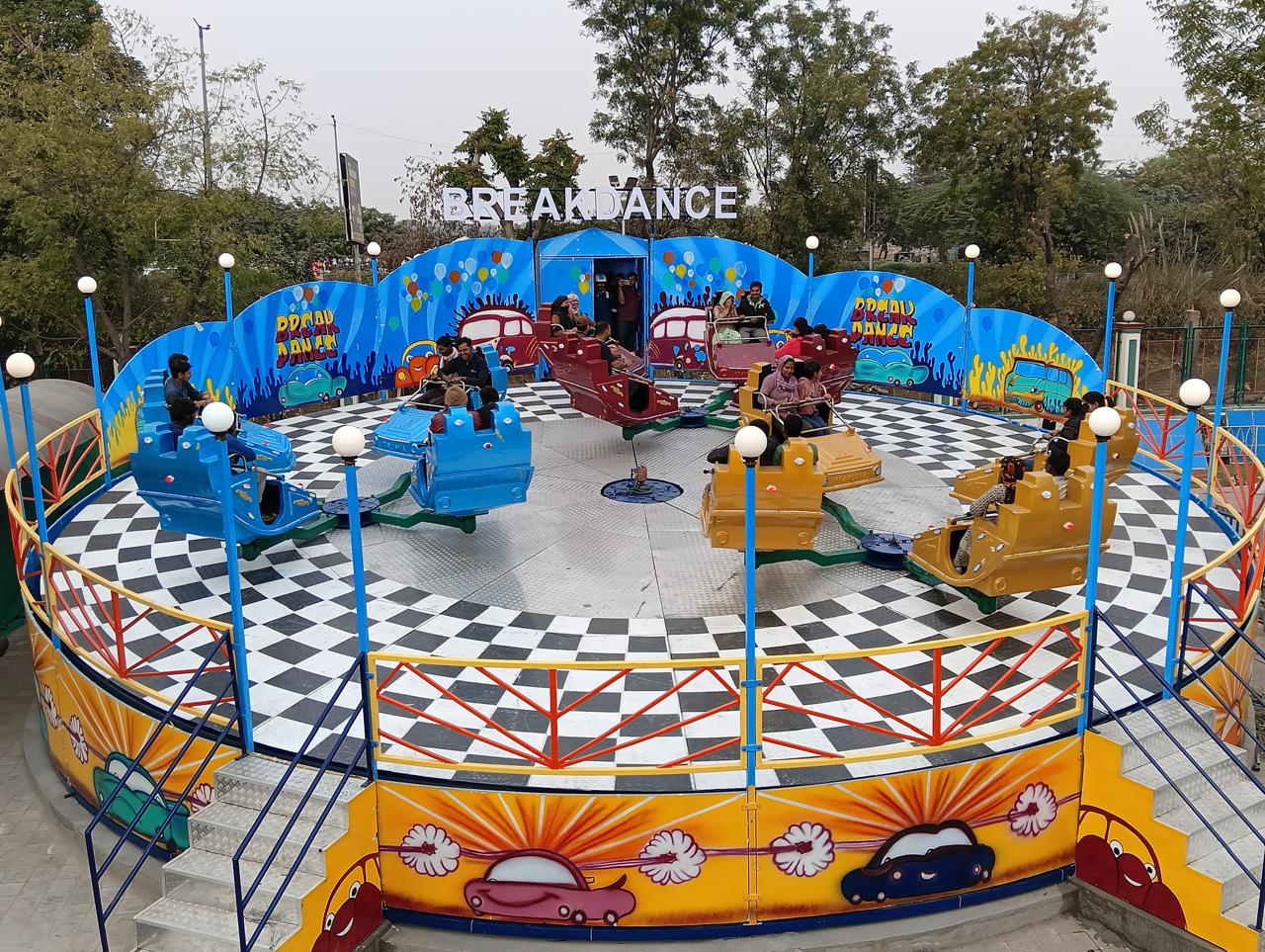 Cozy orange velvet lounge chair by glowing lamp.