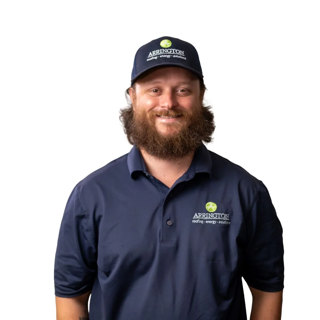 Arrington Heating & Cooling technician with beard and blue cap and polo.