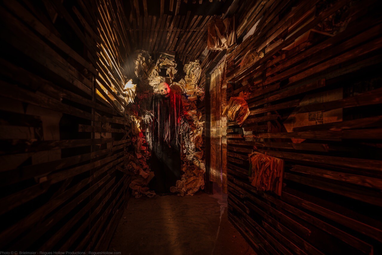 Haunted room with a covered body on a tiled table