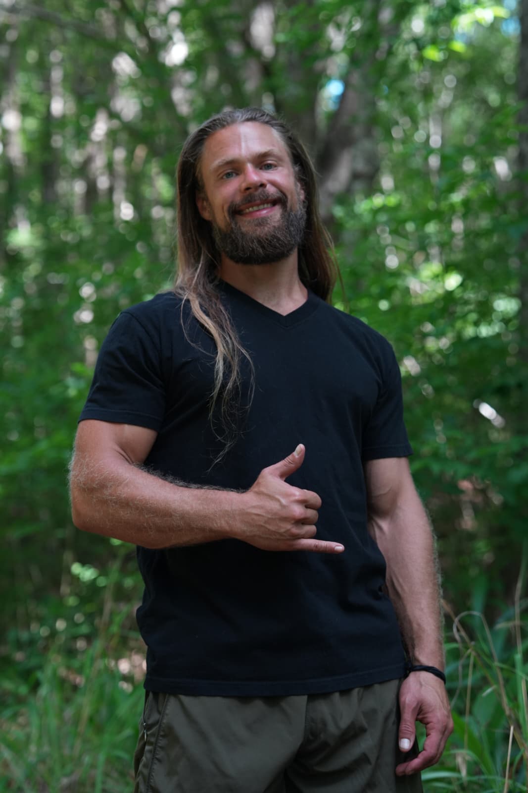John Kempf Photo doing a hangloose in a nature place