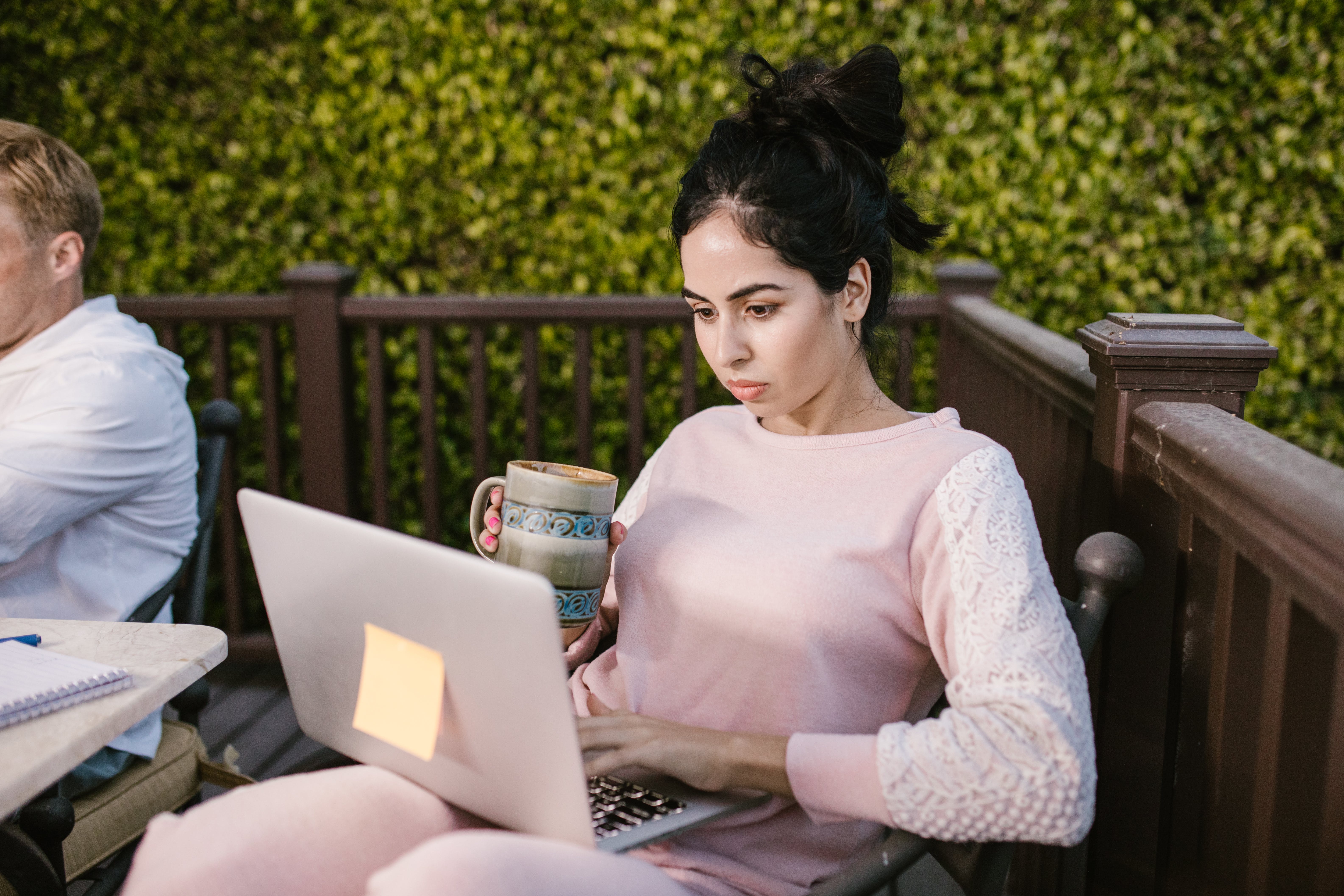 Woman using her laptop asking permission to send cold emails