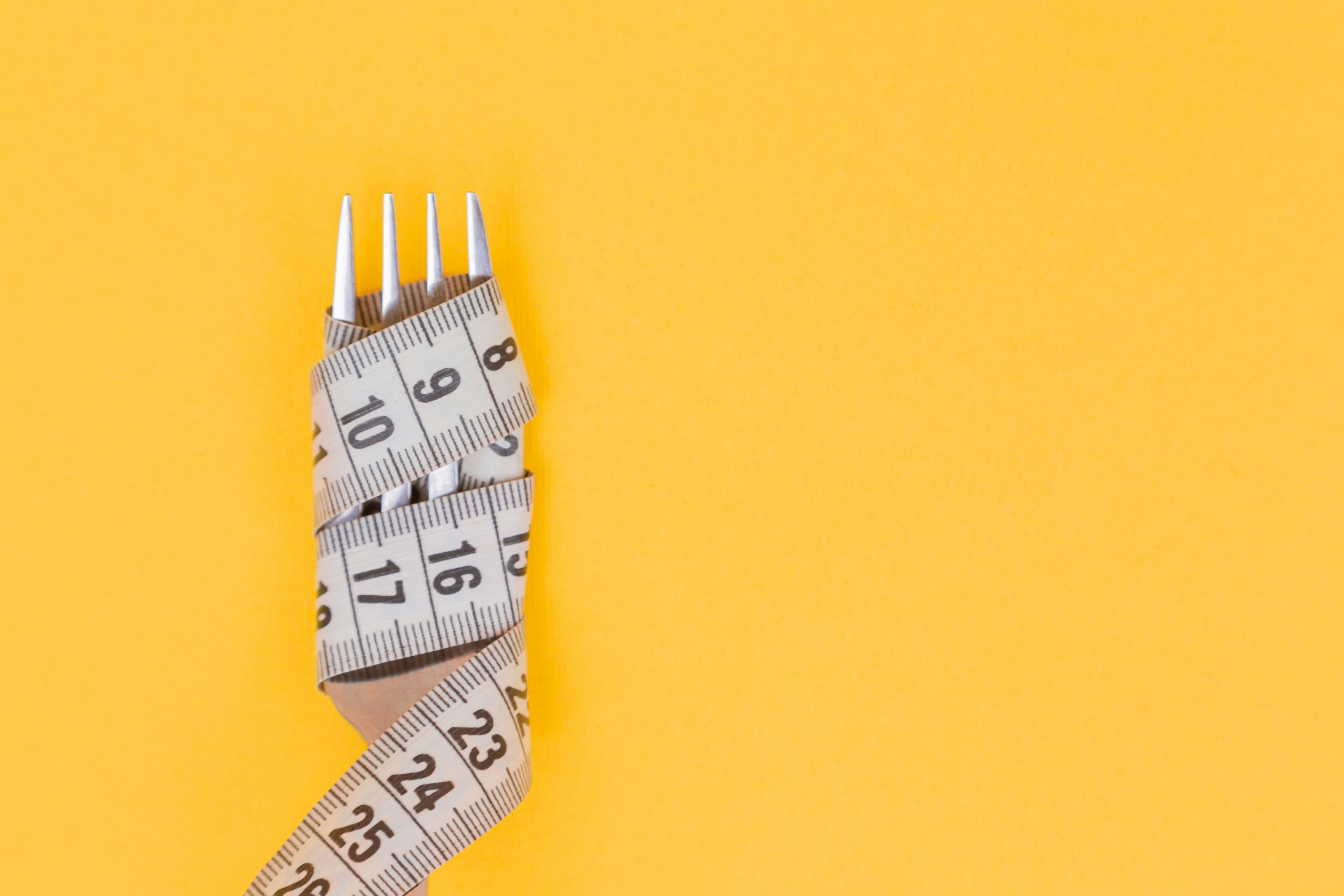 Depiction of a Measuring Tape Wrapped Around a Fork