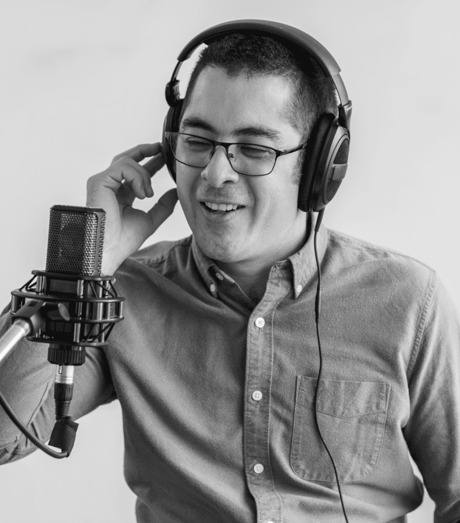A man speaking into a microphone during a podcast