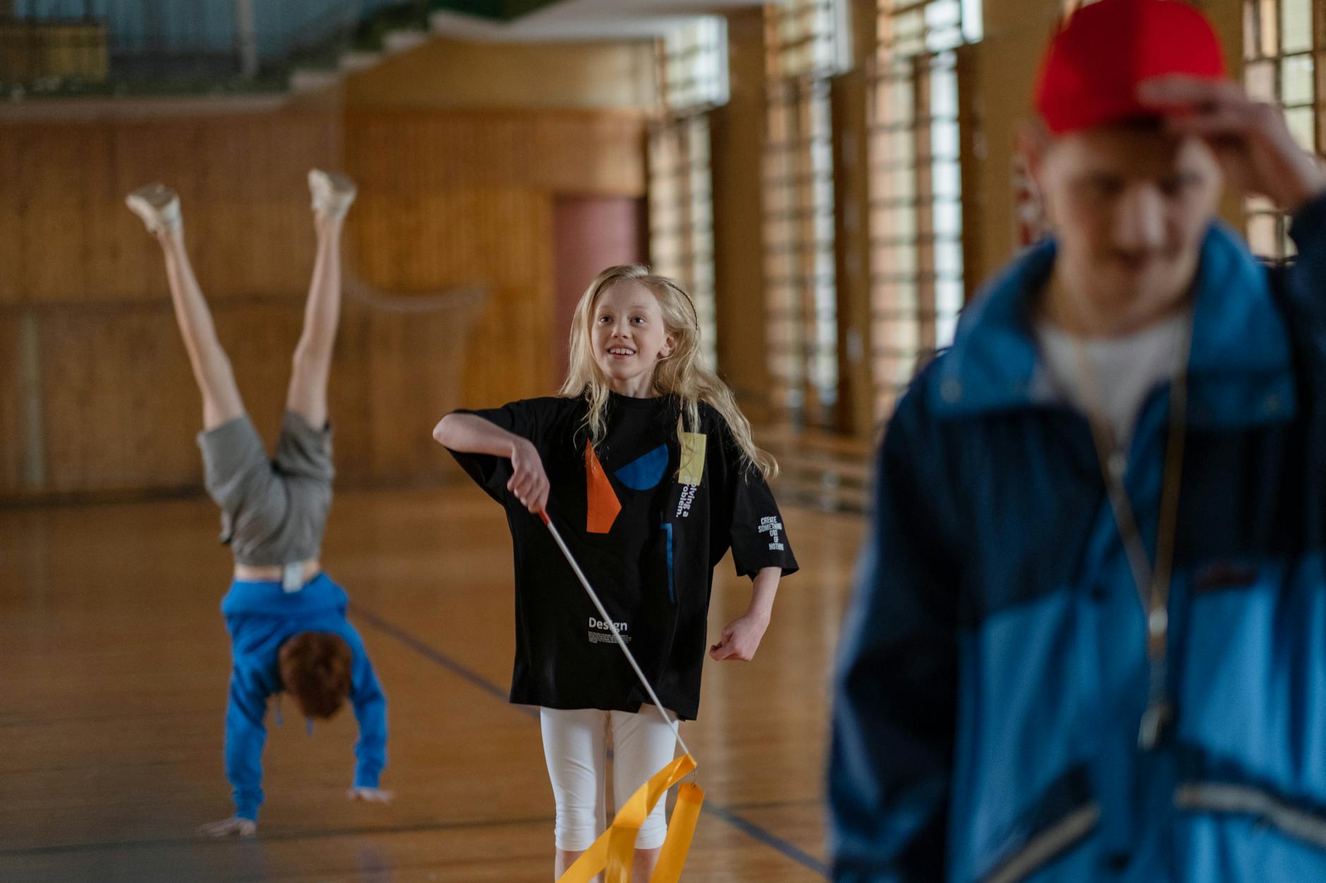 A diverse group of smiling students giving a high-five to their instructor at the end of a successful class.
