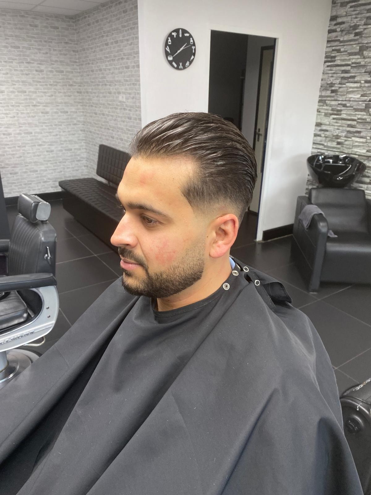 Barber attending client