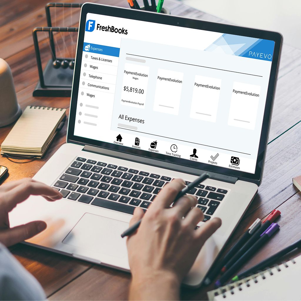 Person typing on laptop showing FreshBooks expense categories with PaymentEvolution wage data and navigation menu
