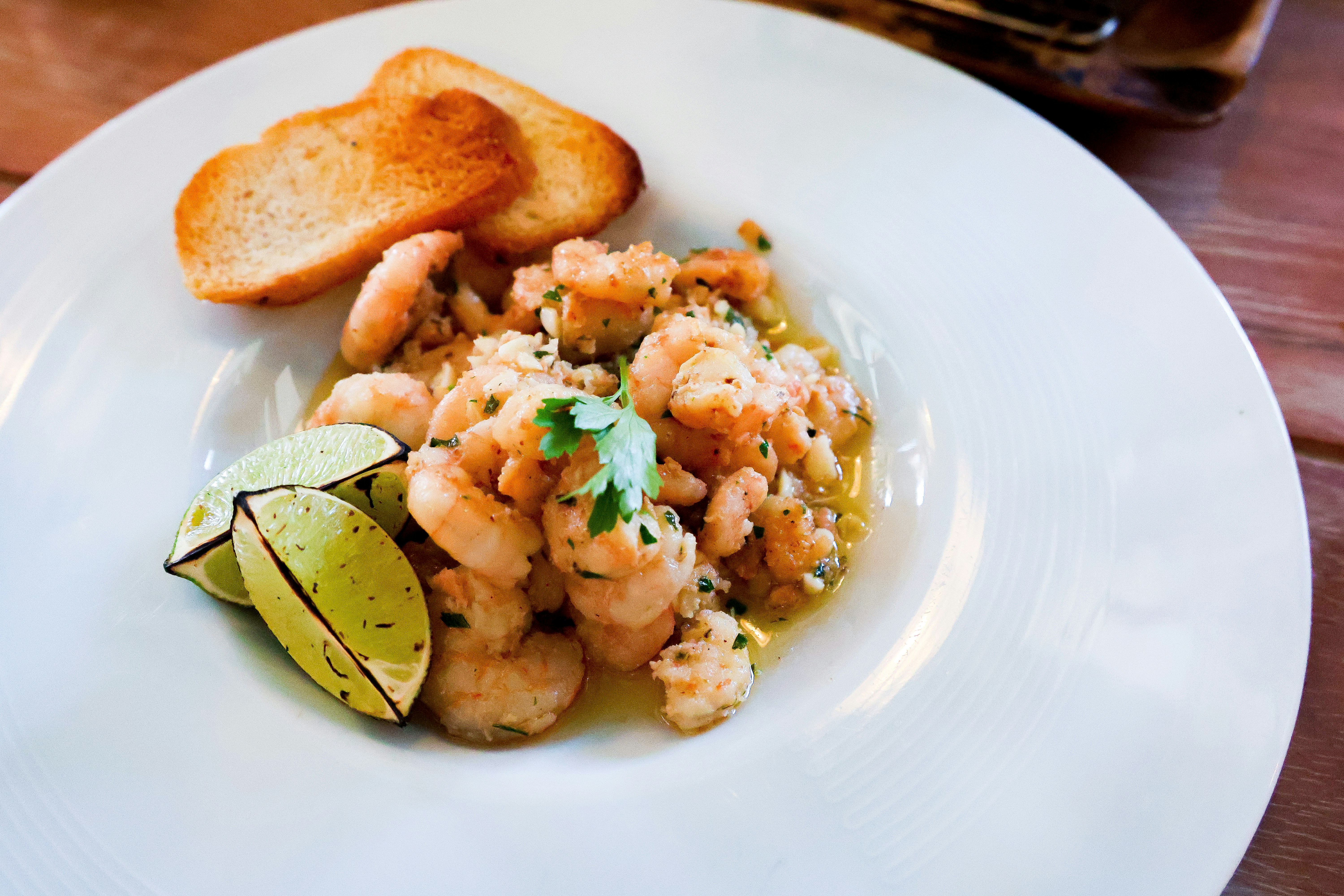 Shrimp ceviche with lime and toasted bread.