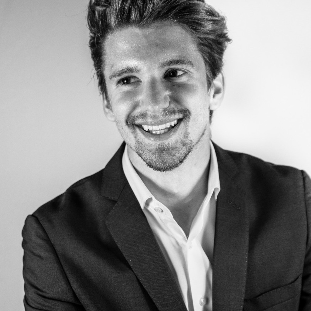 Business headshot of a confident white woman with a neutral expression, set against a minimal gray background