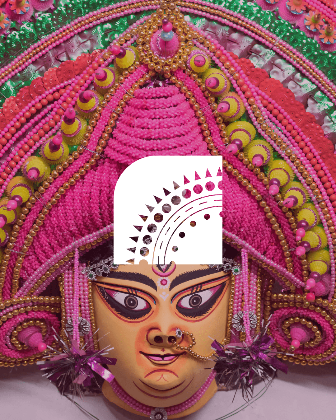 Tvarita curved ornament motif over an ornate traditional mask.