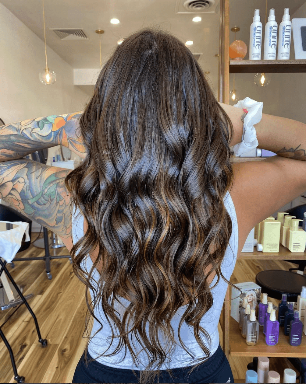 Subtle chocolate brunette with weft extensions by Tannya Speir at Del Sol Hair Studio Huntington Beach