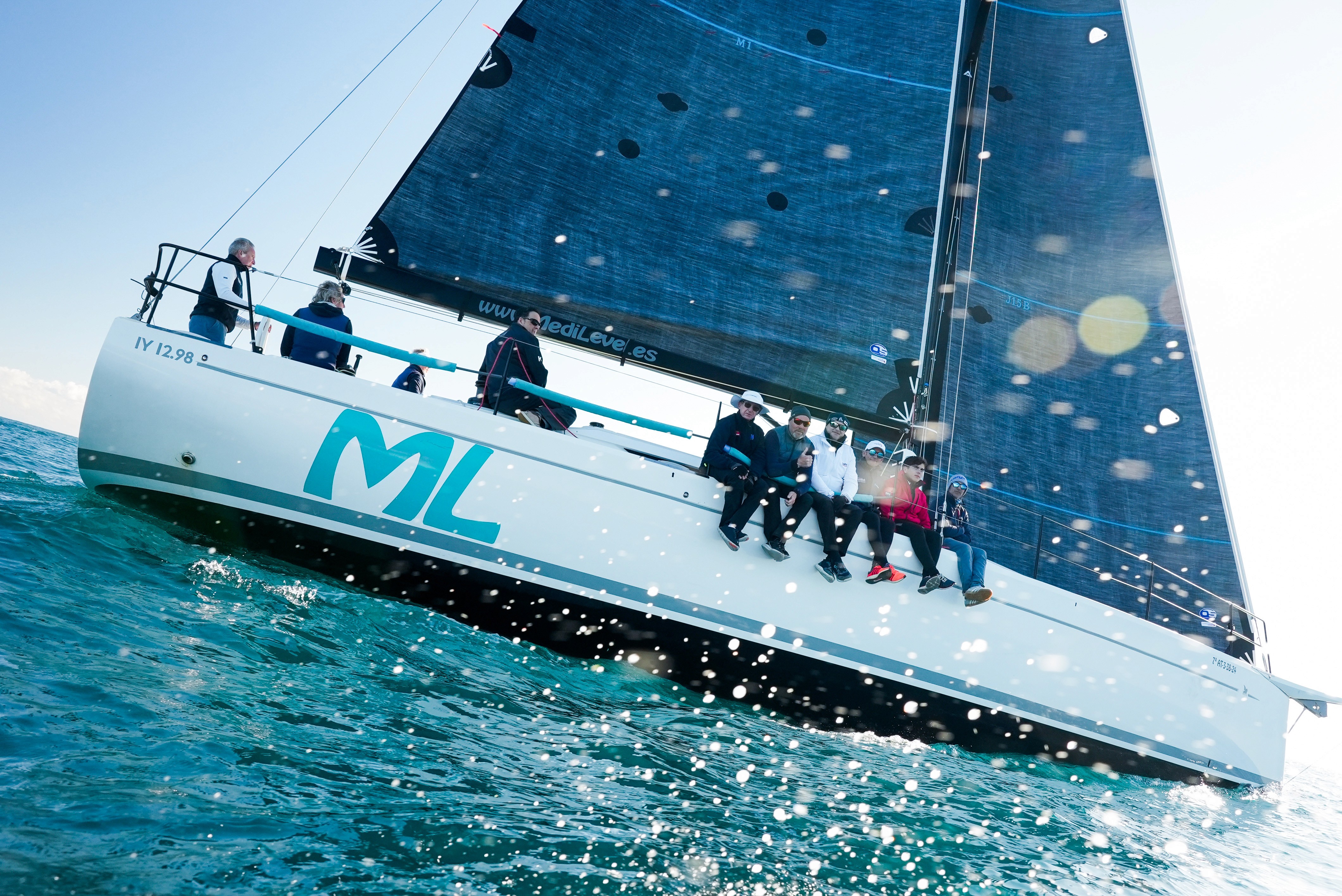 Two men wearing yellow and black face masks, standing side by side, with neutral expressions on their faces.