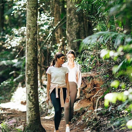 Girls walking in the rainforest