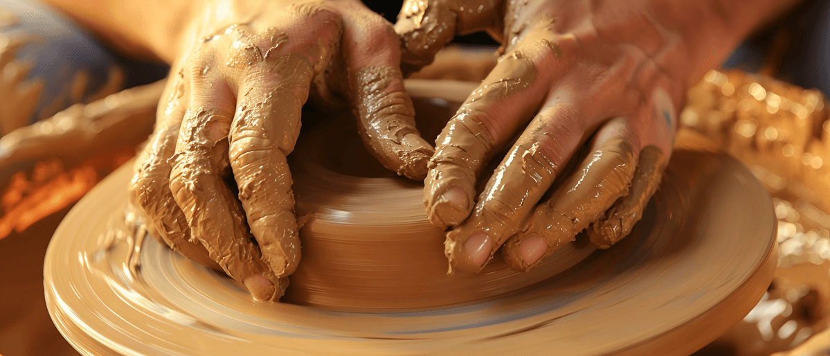 Hand in a Clay Wheel
