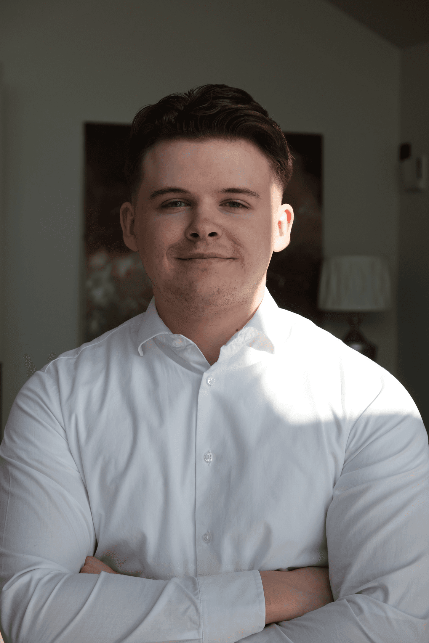 Portrait of a person in dark clothing speaking on a phone