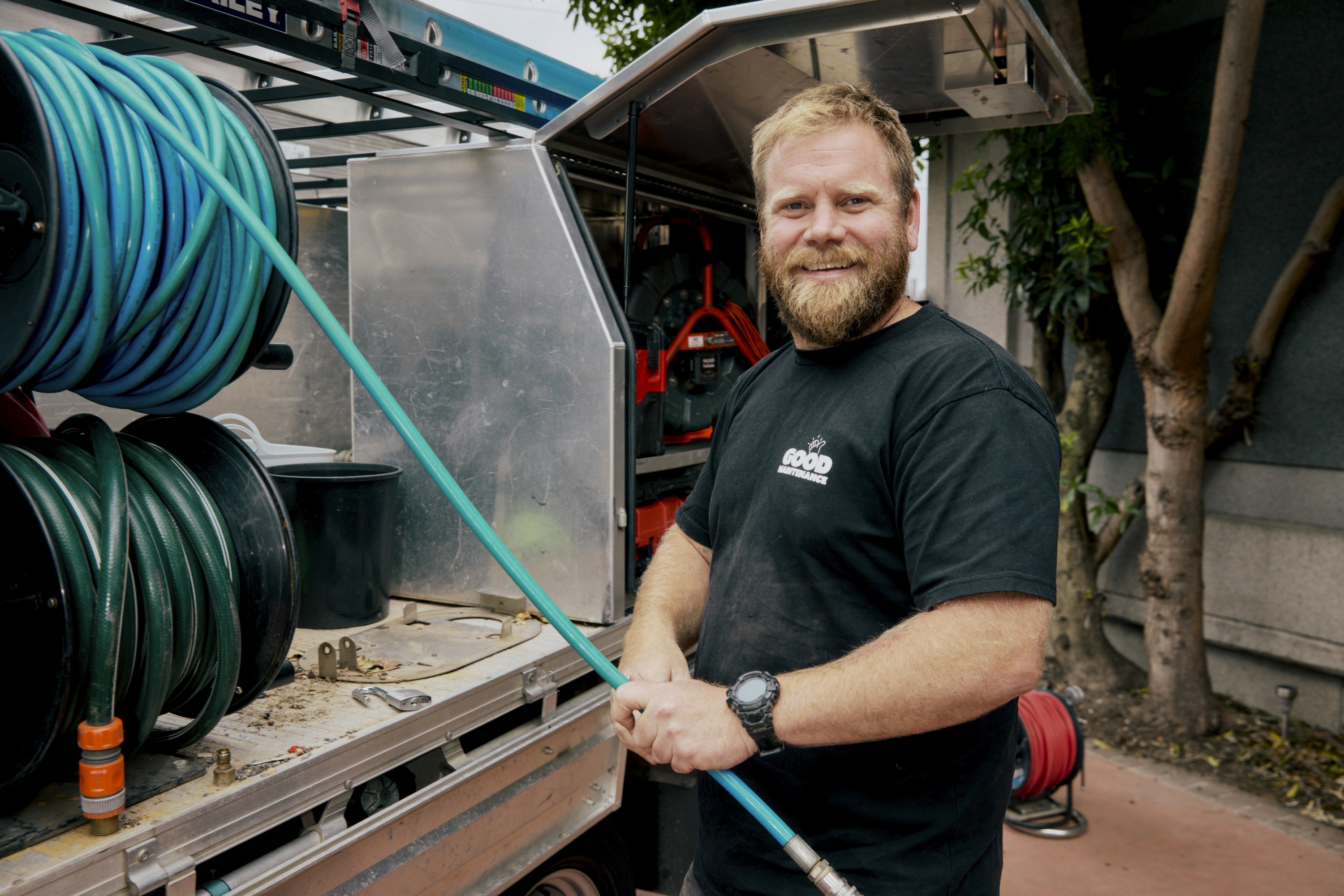 Good Maintenance Plumber Posing Infront of Truck