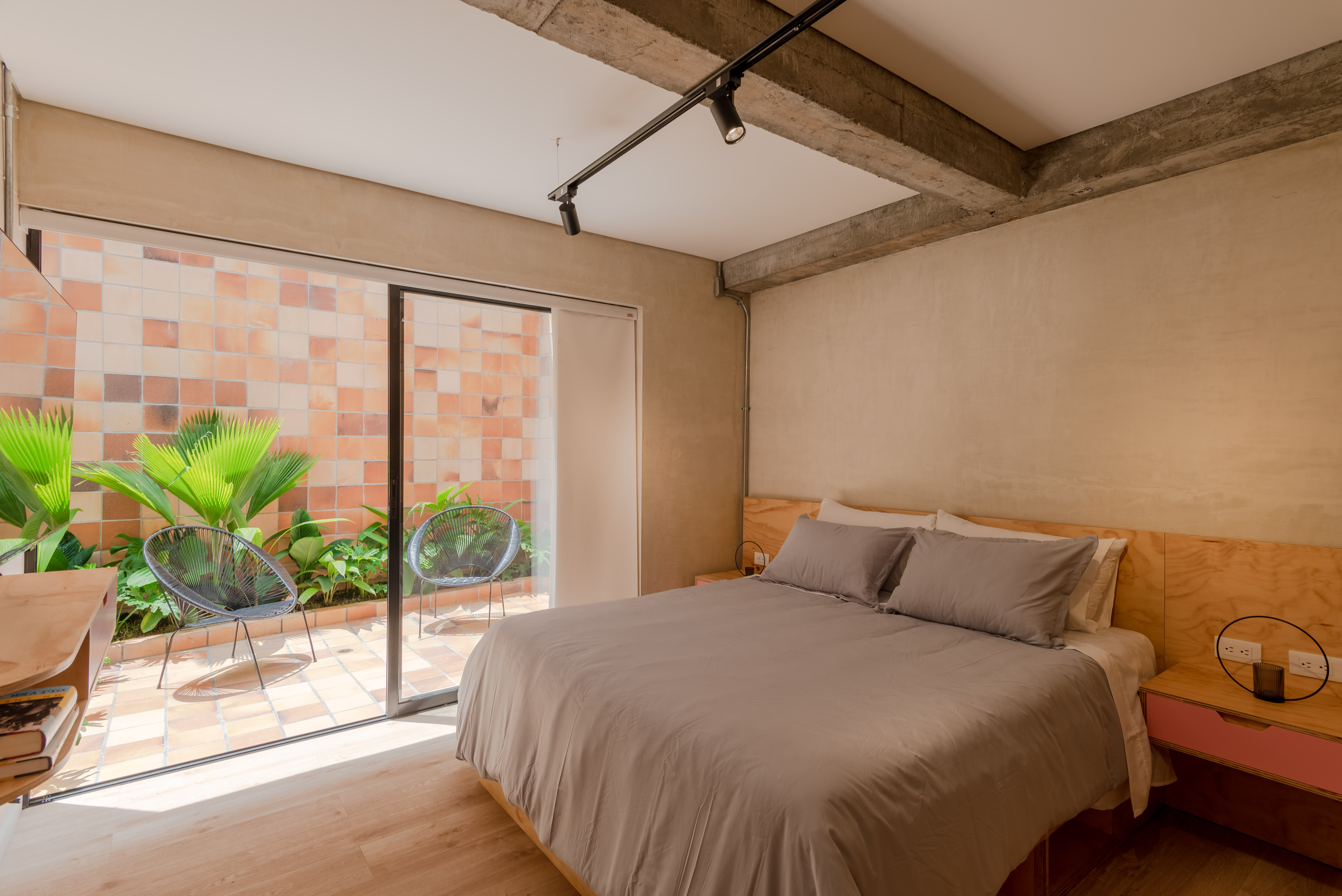 Double-height interior with flowing sculptural forms and warm raking light
