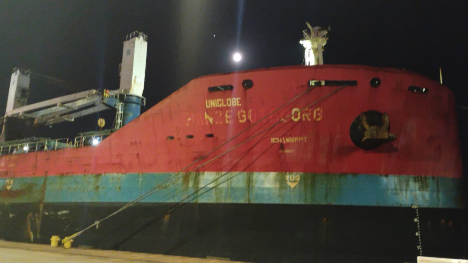 UNIGLOBE bulk carrier alongside at Paranagua Port at night during cargo hold inspection attendance (cleanliness & suitability).