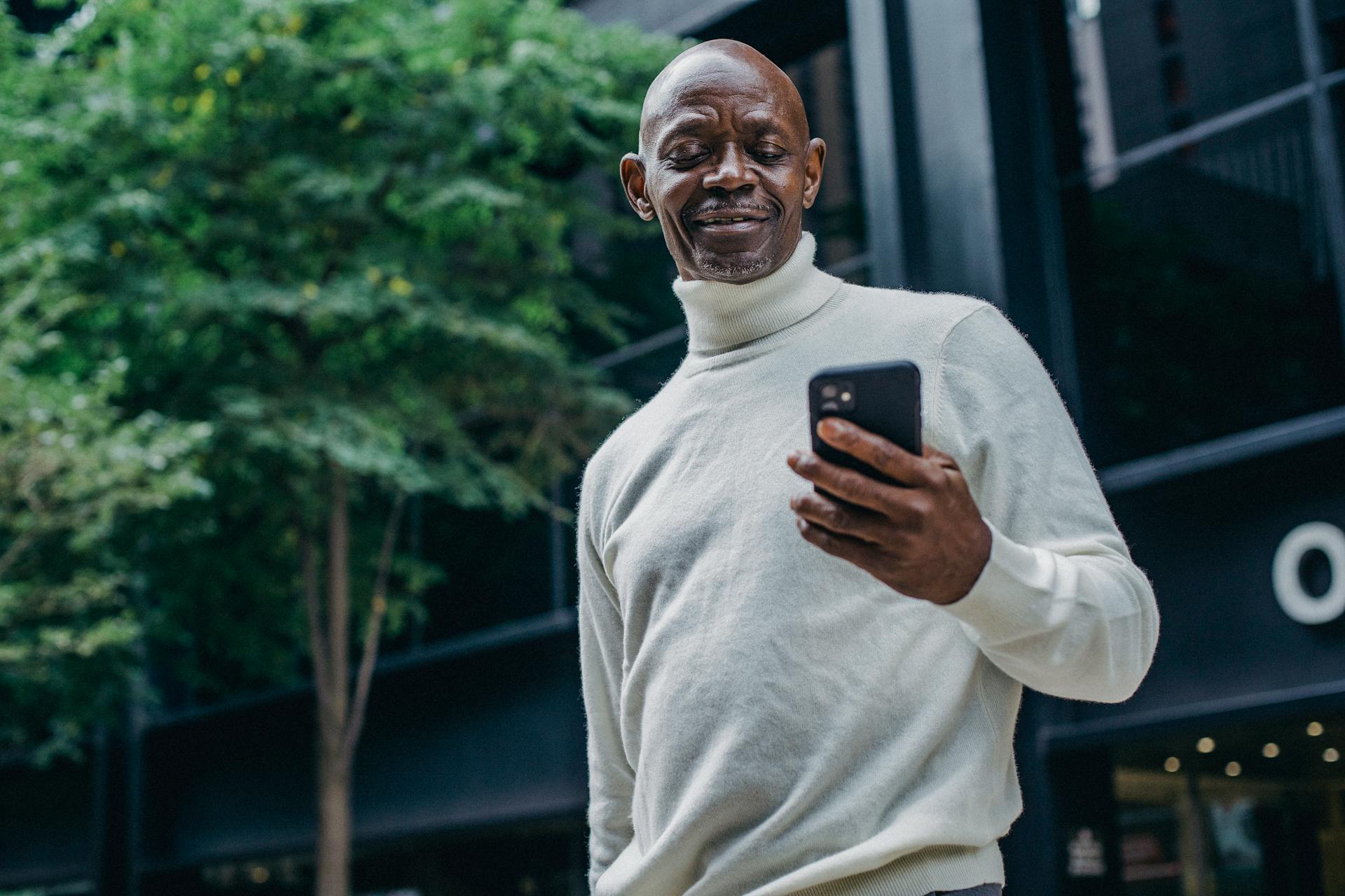 person looking into his mobile phone