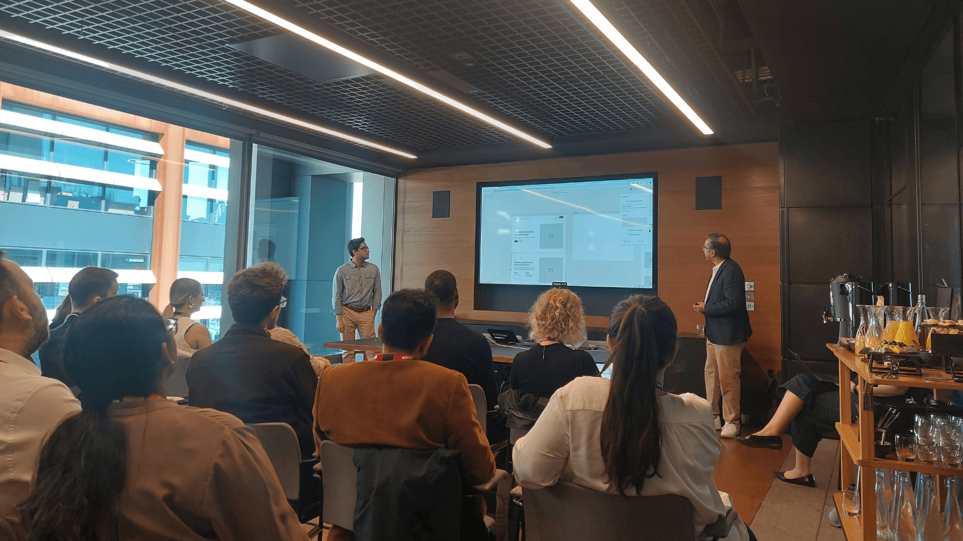 A room full of people attending a presentation on the opportunities of AI