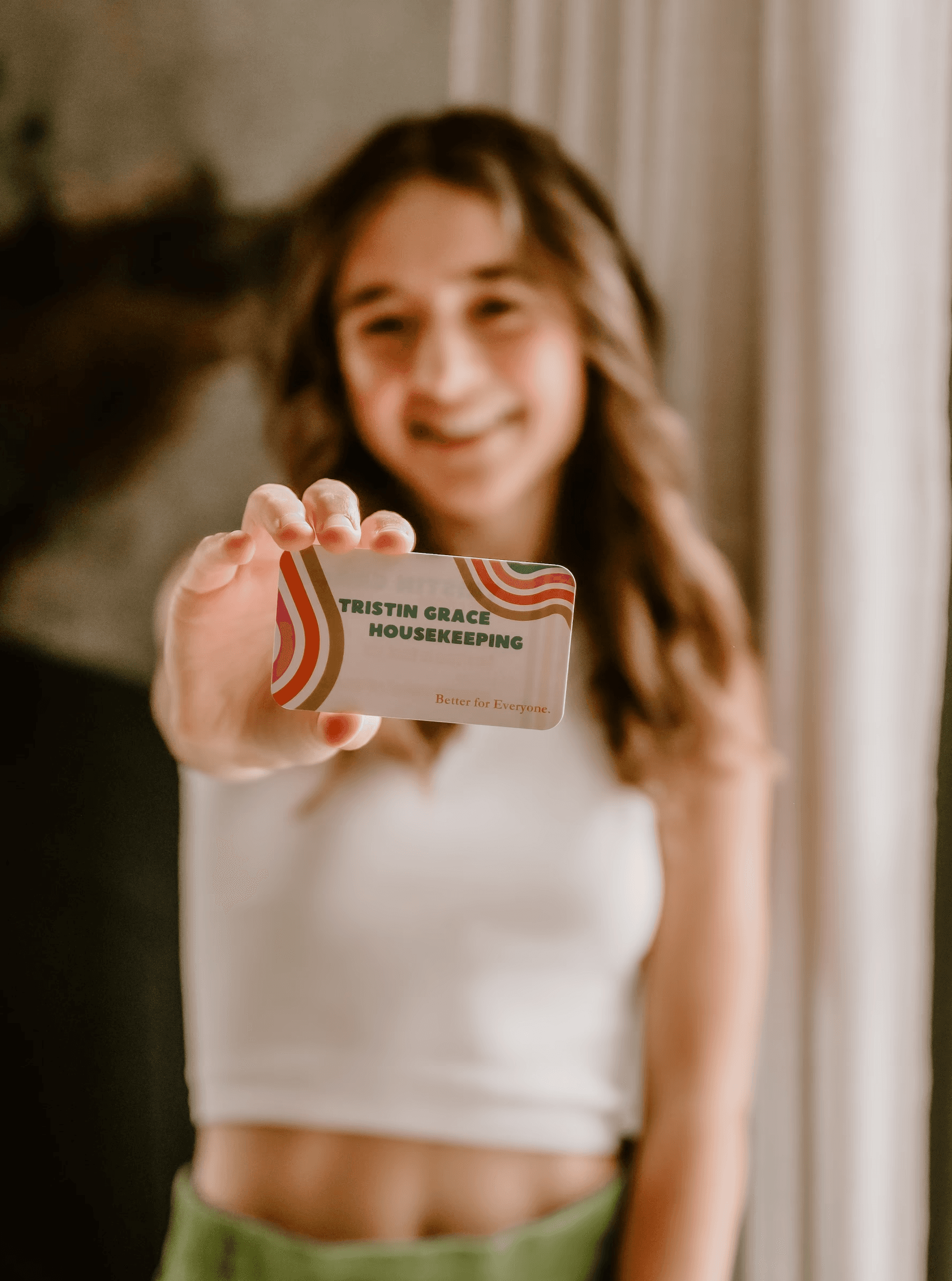 Tristin Grace Holding Her Business Card