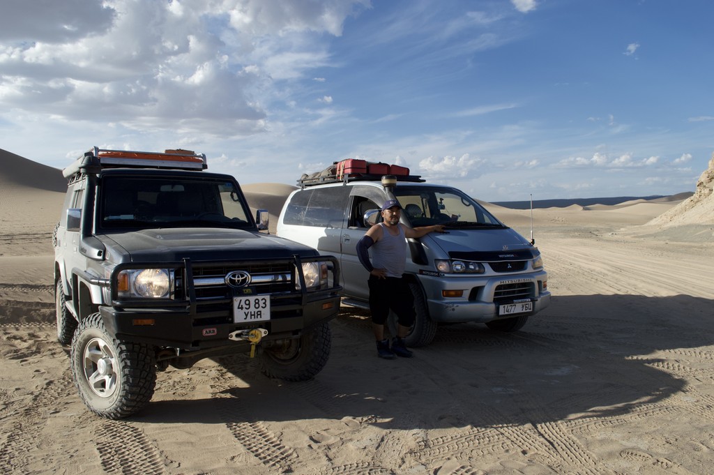Mongolian Guide with his big off-road vehicles