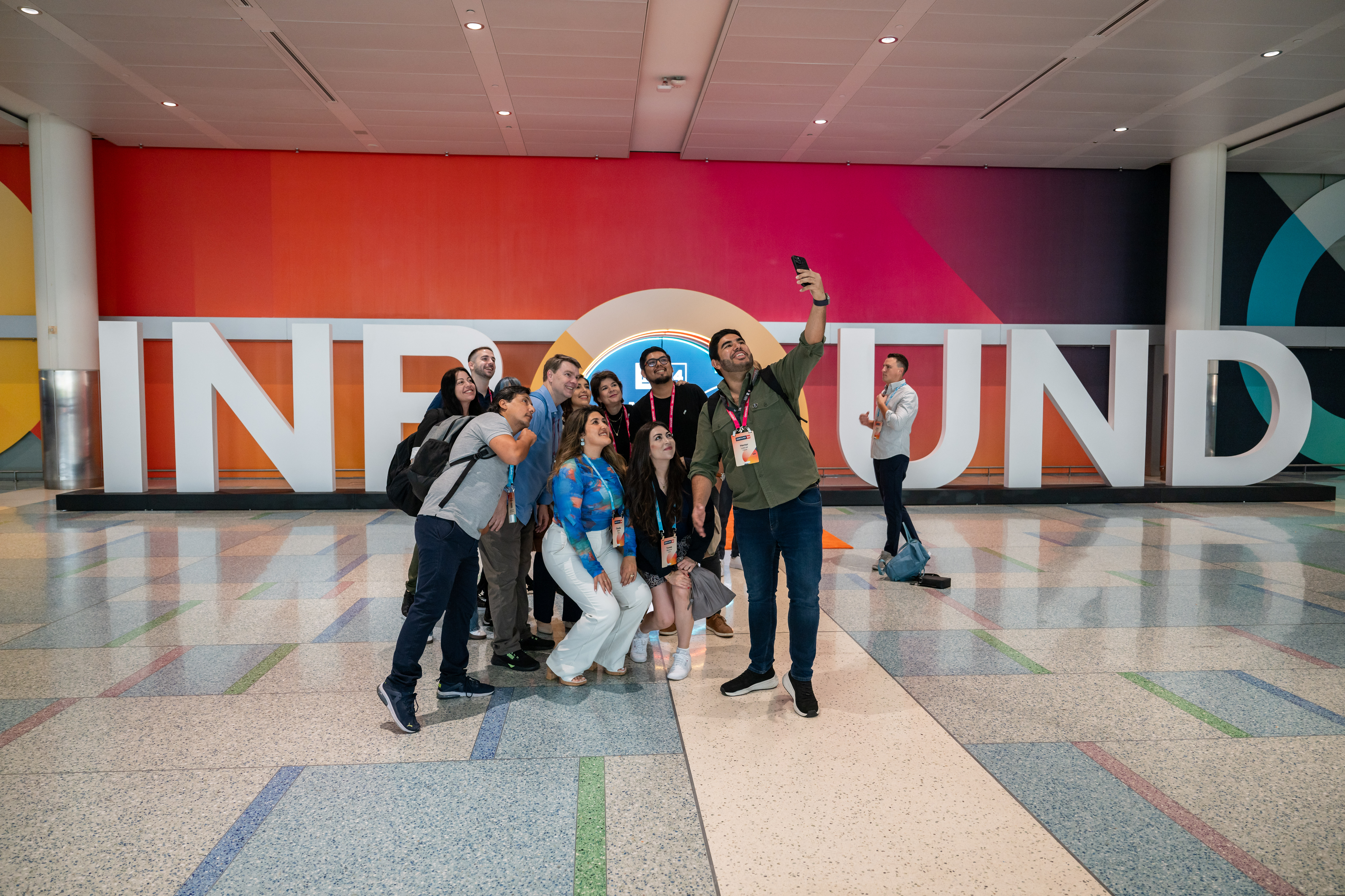 two cell phones on a gray surface