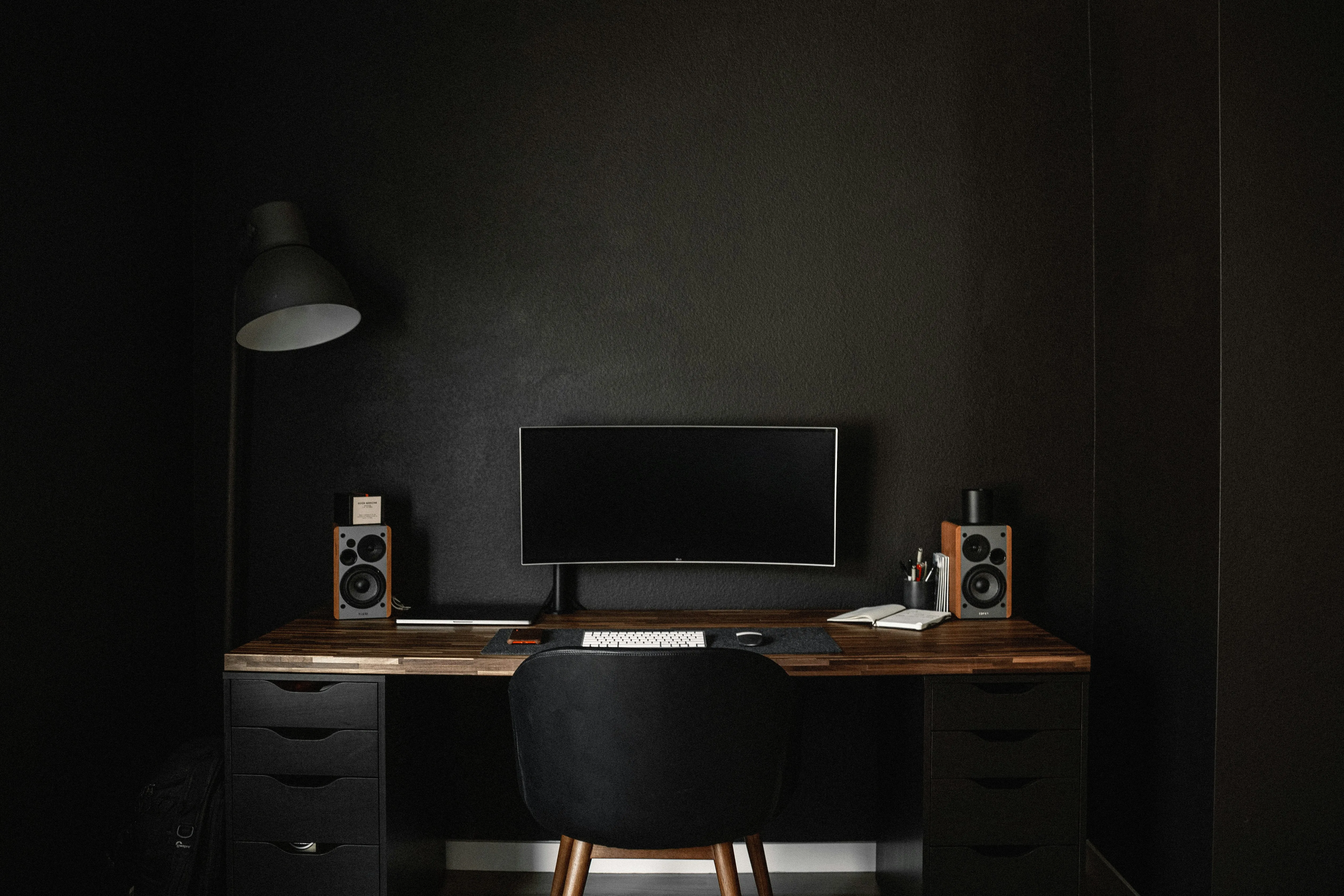 A desk with a computer on top of it