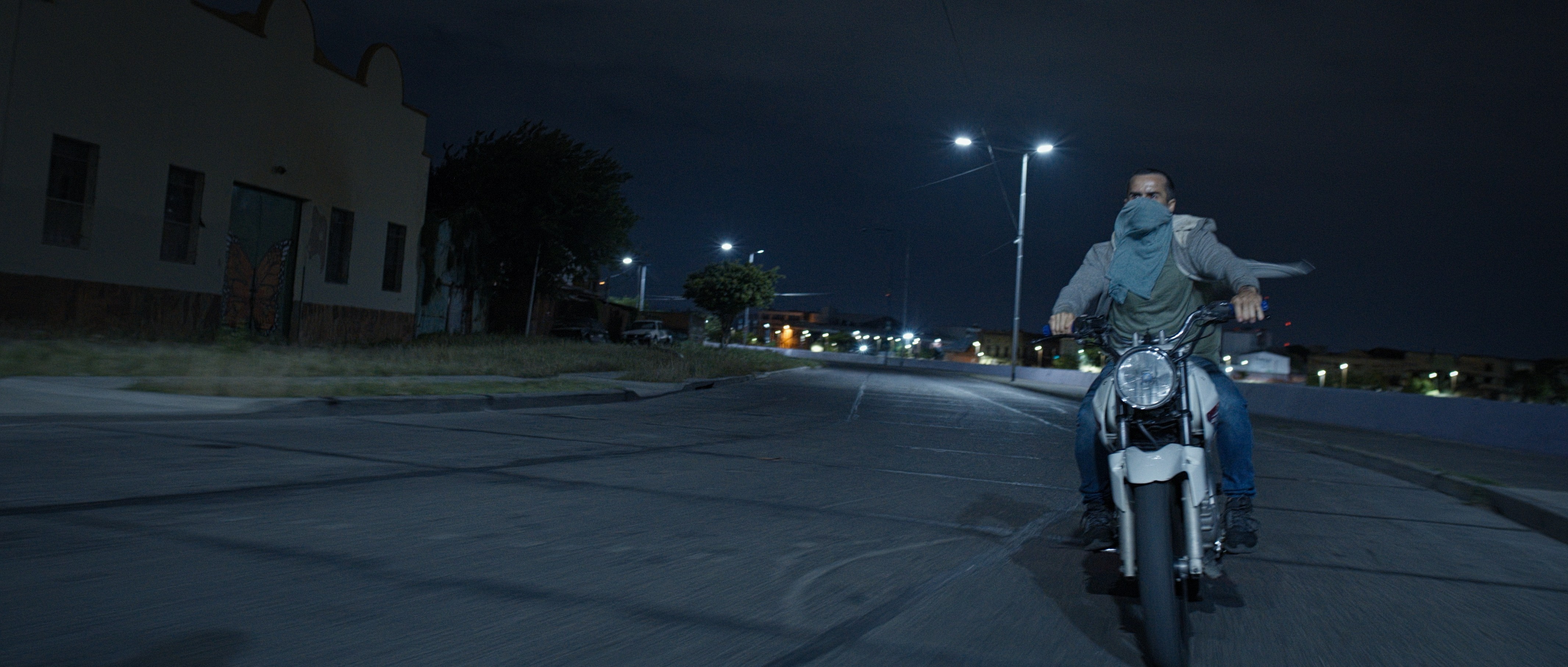 A person stands in a sandstone cave.