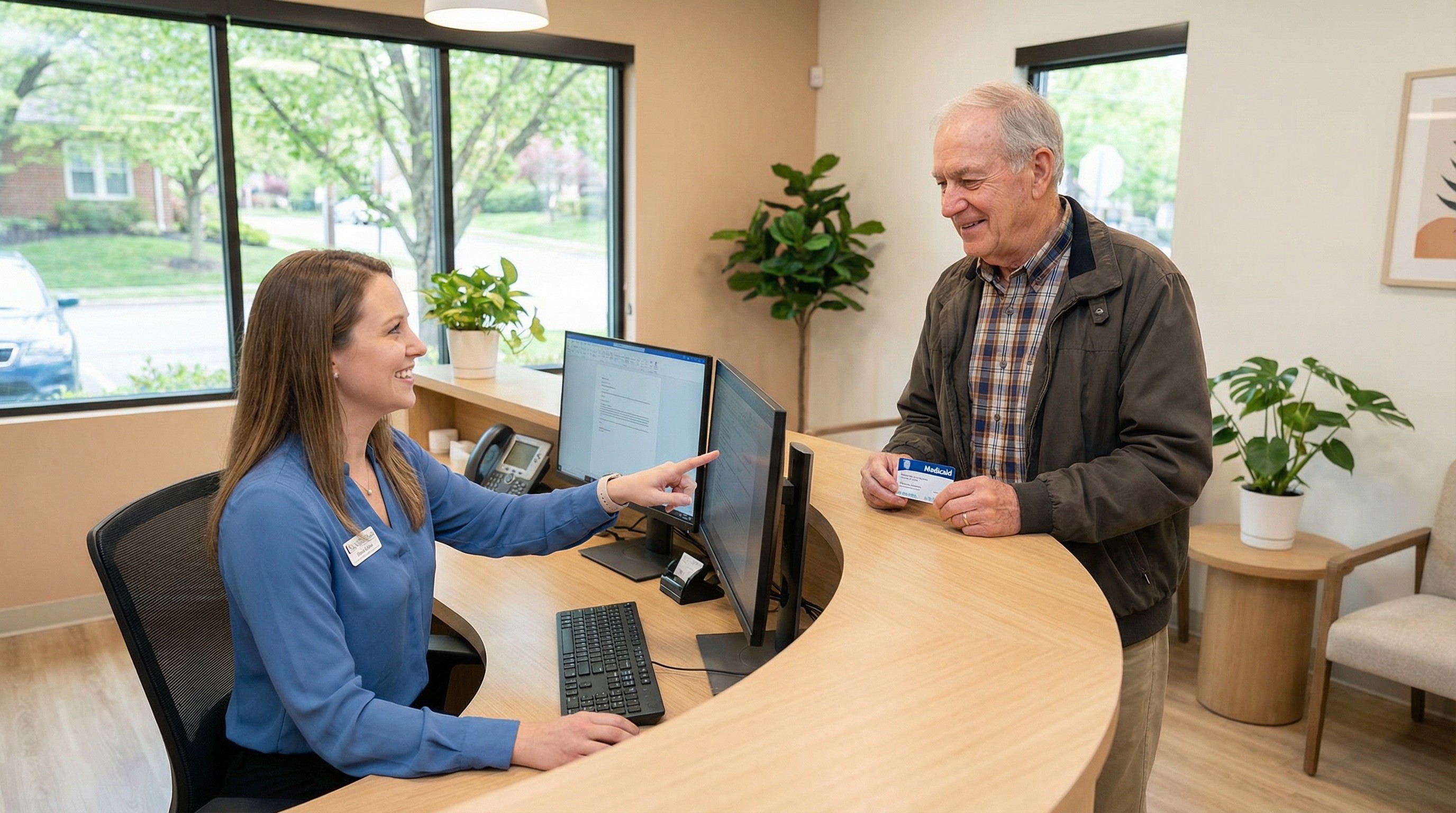 Friendly dental office billing staff member assisting patient with Medicaid coverage verification and benefit explanation at Veda Family Dentistry in West New York, New Jersey.