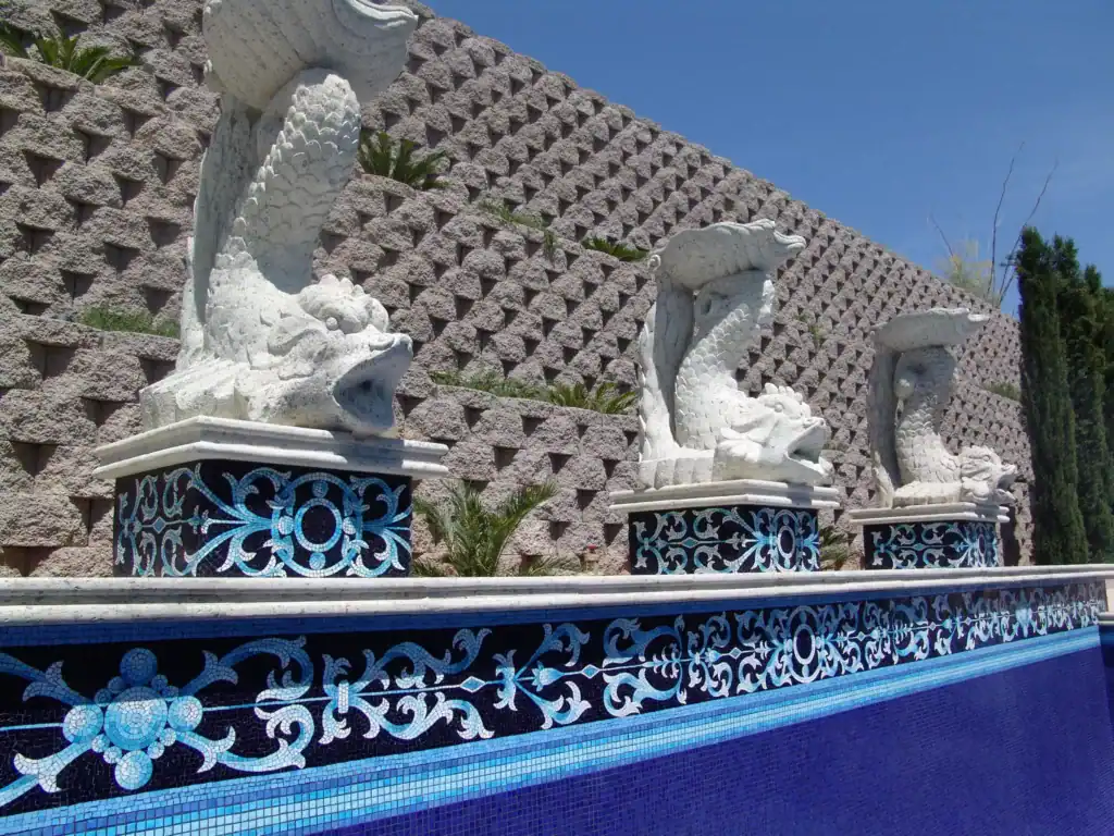 Fountain with three white dragon sculptures at Mosaiclegs Art Studio.