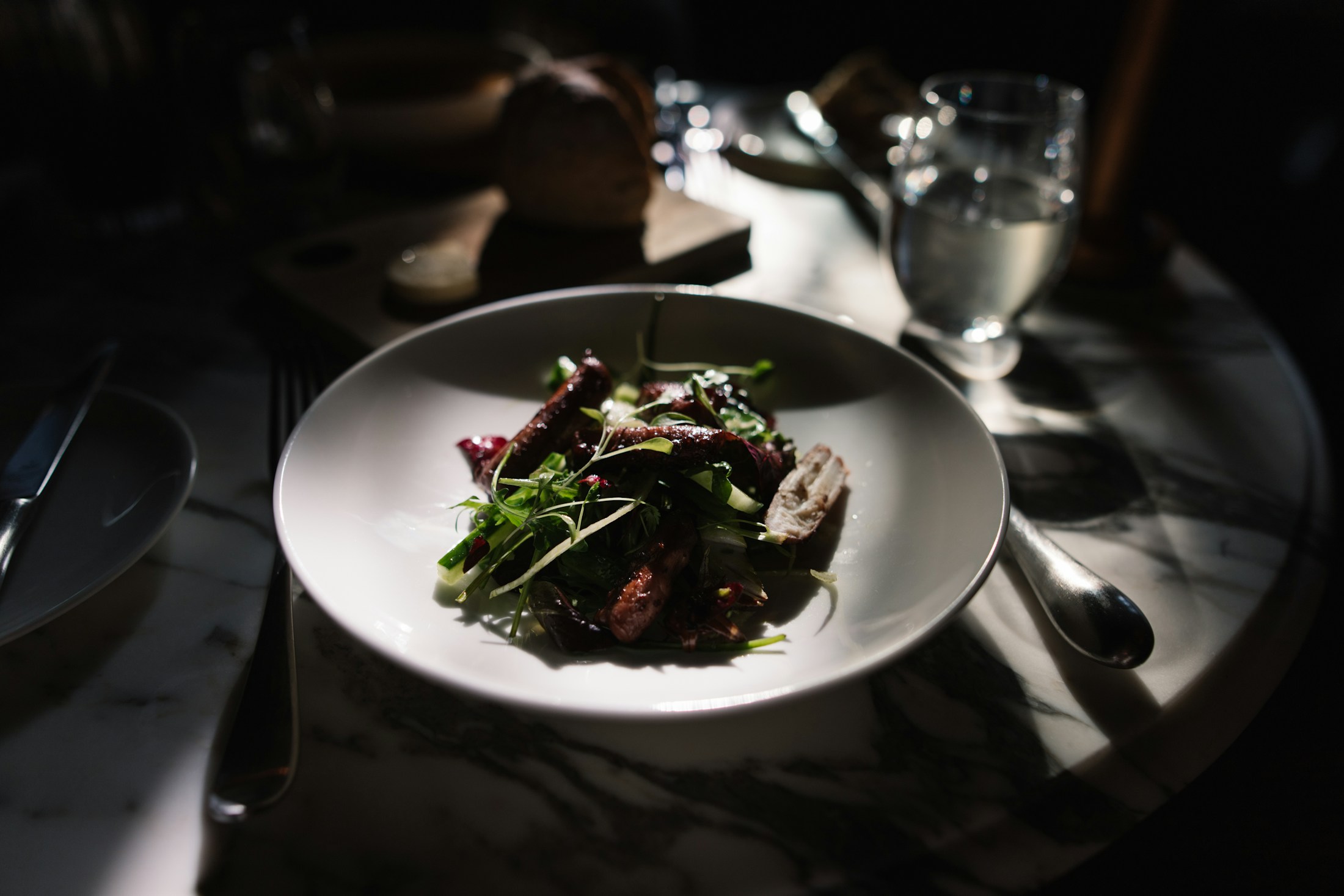 Elegant food plate in a dark restaurant