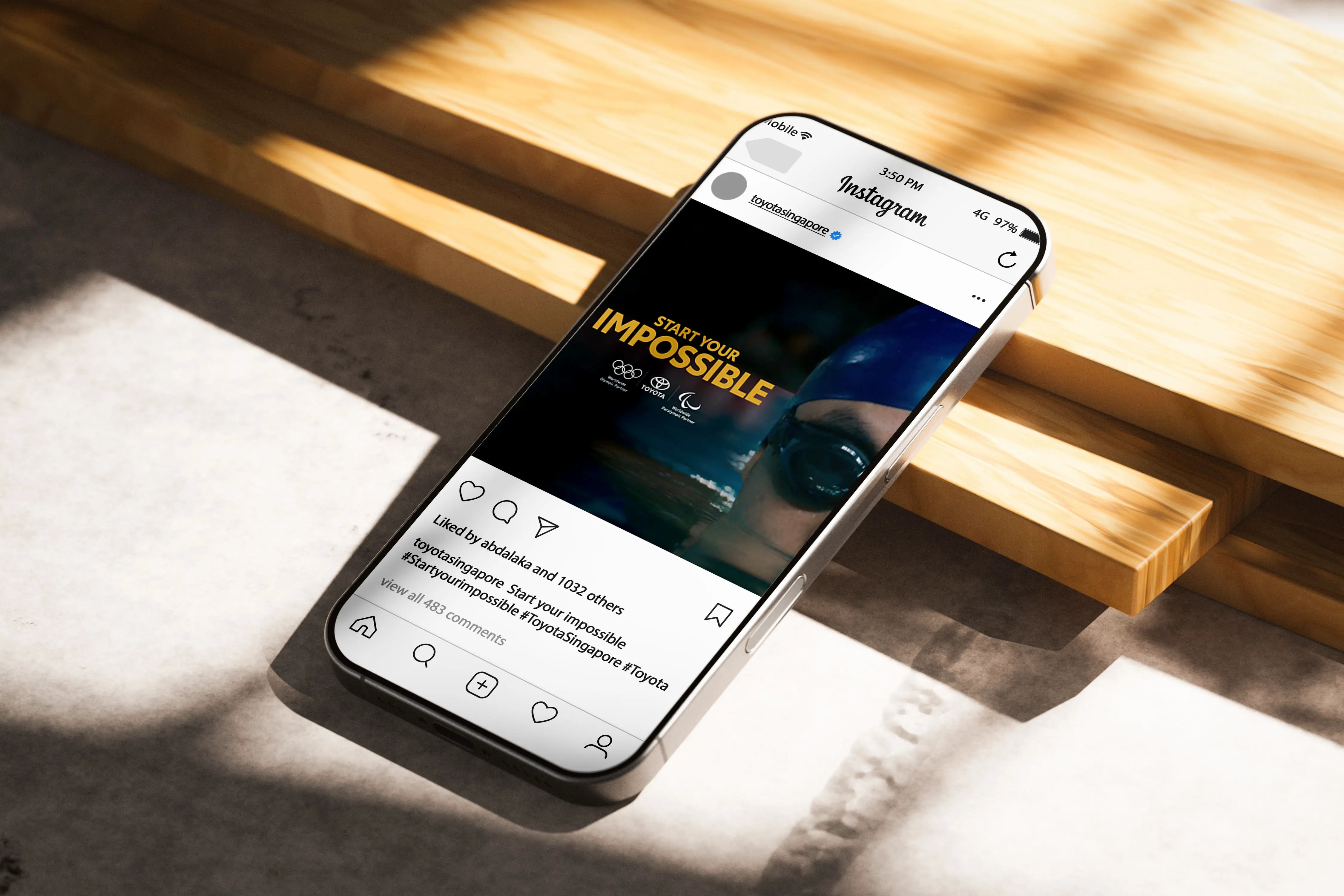 image of apple iphone with the screen display of  a instagram post of toyota singapore Start your impossible campaign with Olympic and Paralympic