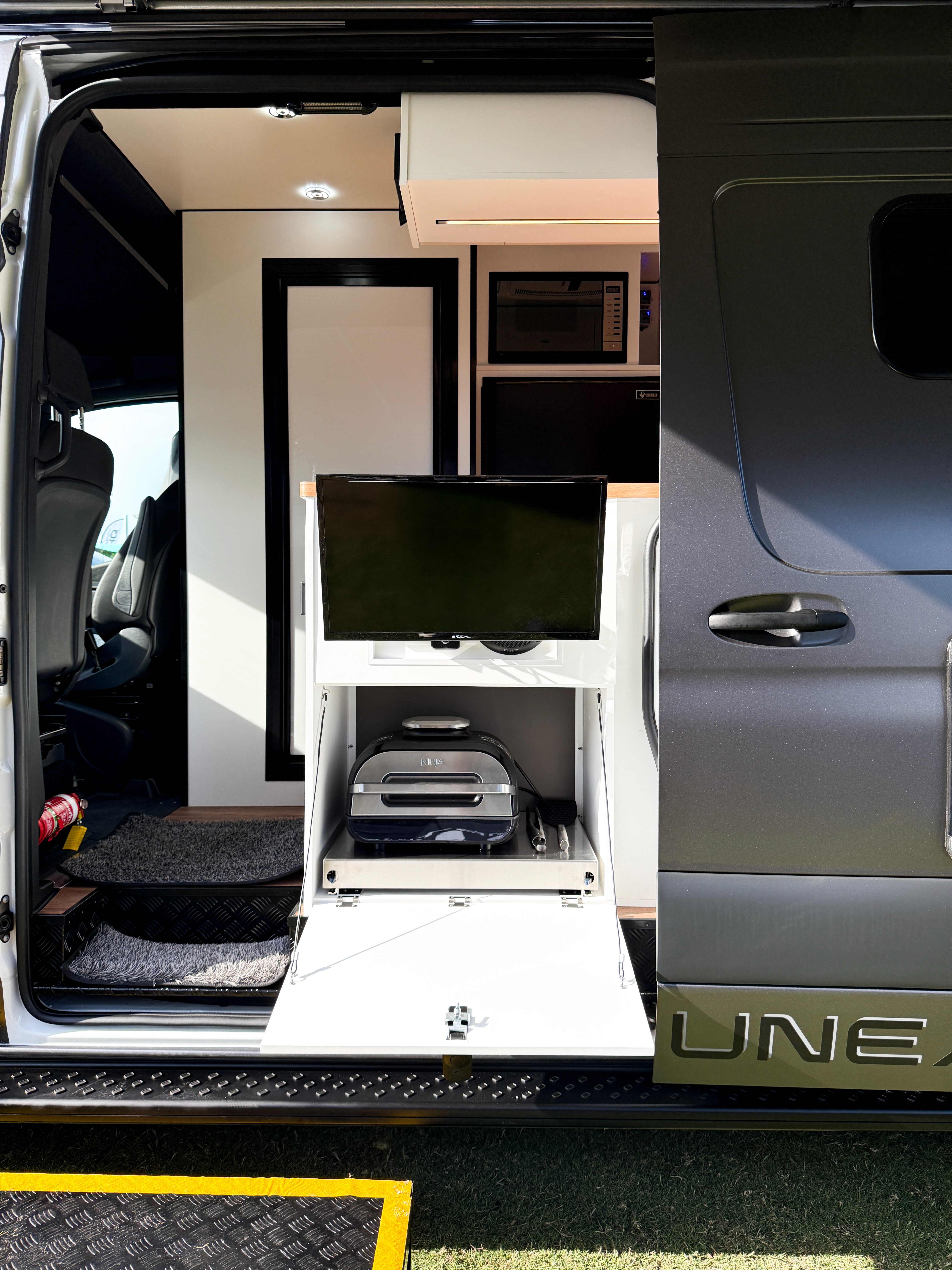 Campervan side entry cooking & entertainment