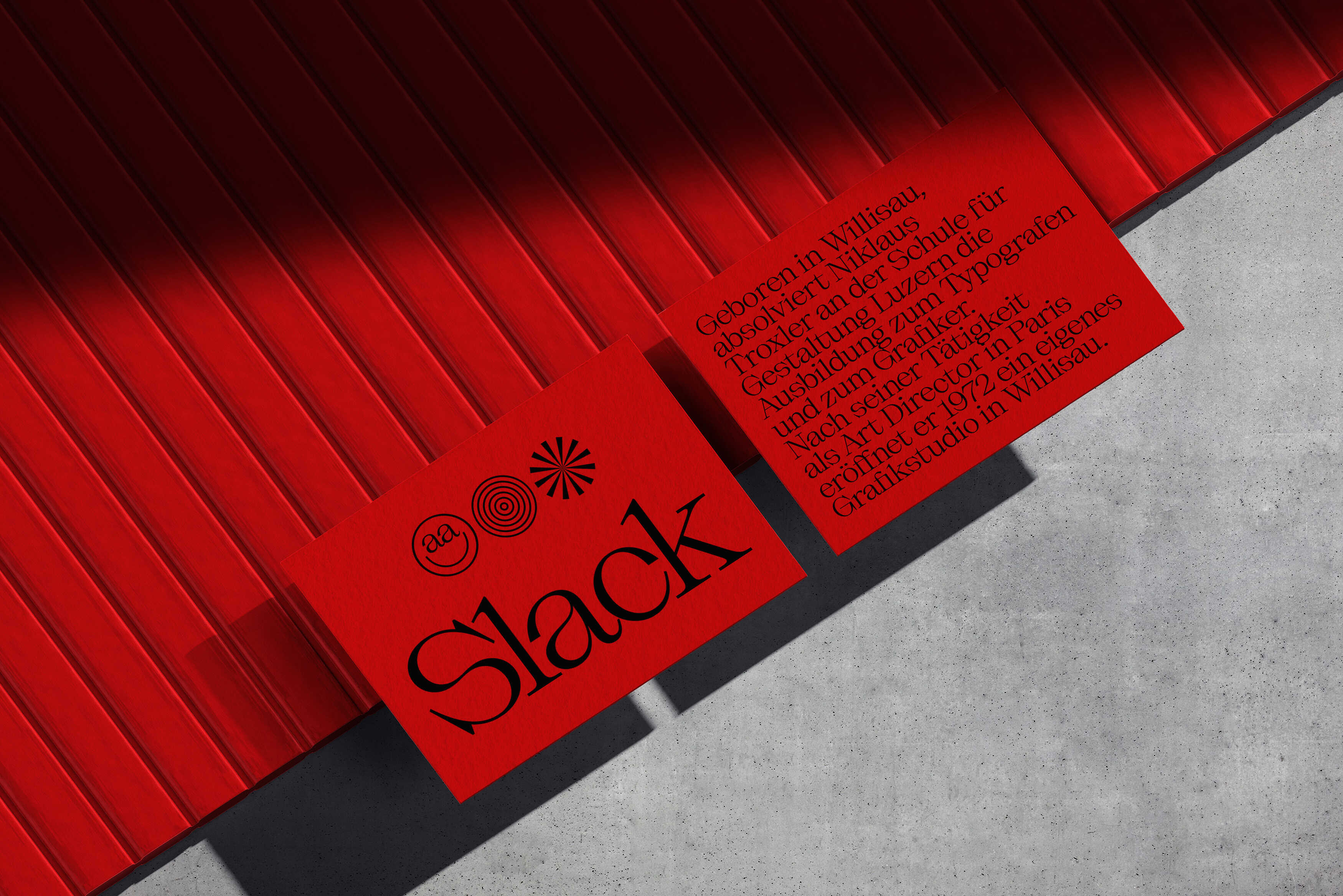 Red printed cards with black typography placed on corrugated surface