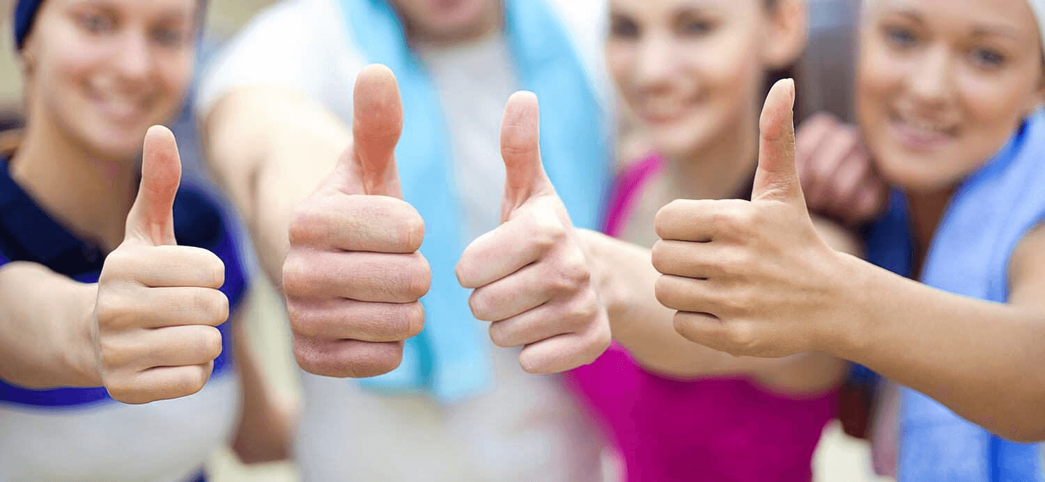 a group of people giving thumbs up