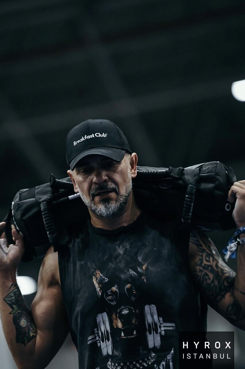 close-up image of a guys shirt wearing a lanyard