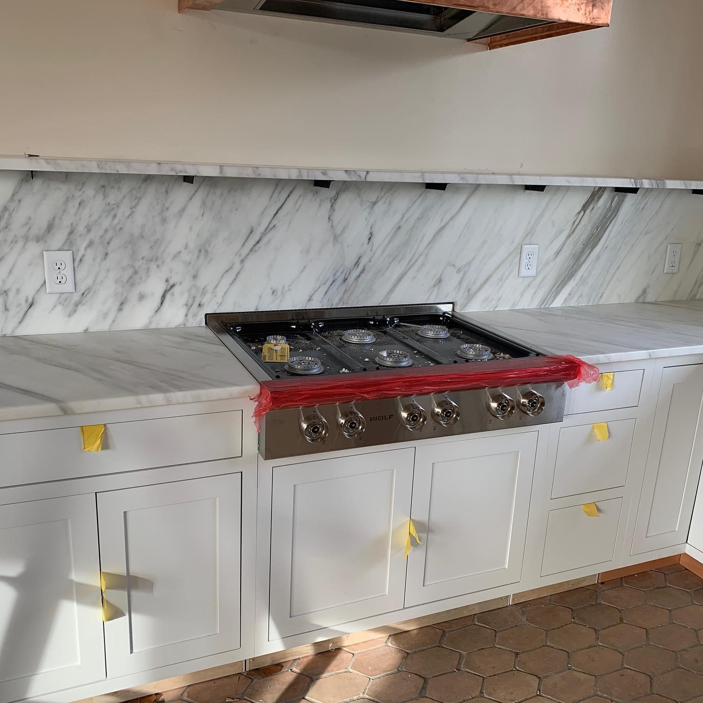 two men facing each other while shake hands and smiling