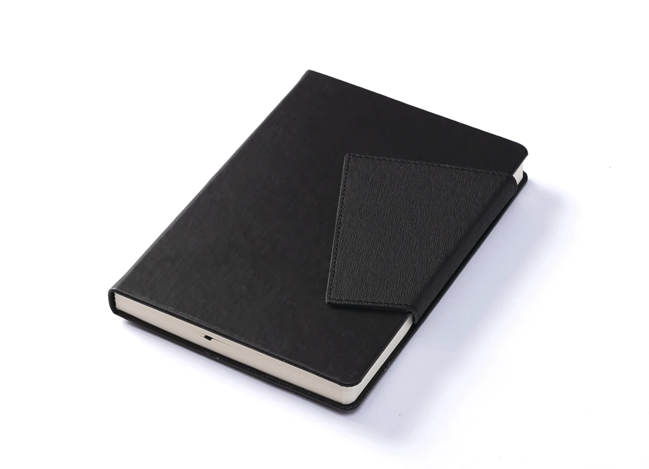 Angled view of closed black notebook with wrap-around closure.