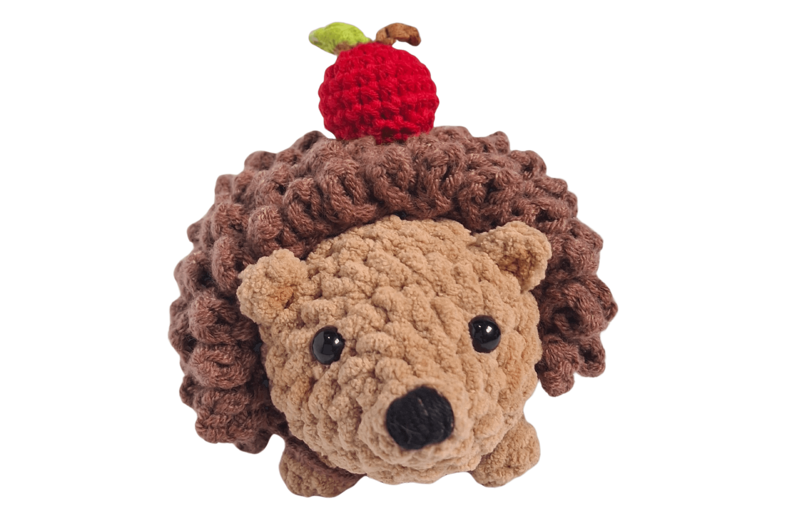 A cute, handcrafted plush hedgehog toy with brown yarn spikes and large, friendly eyes sits facing forward on a white background.