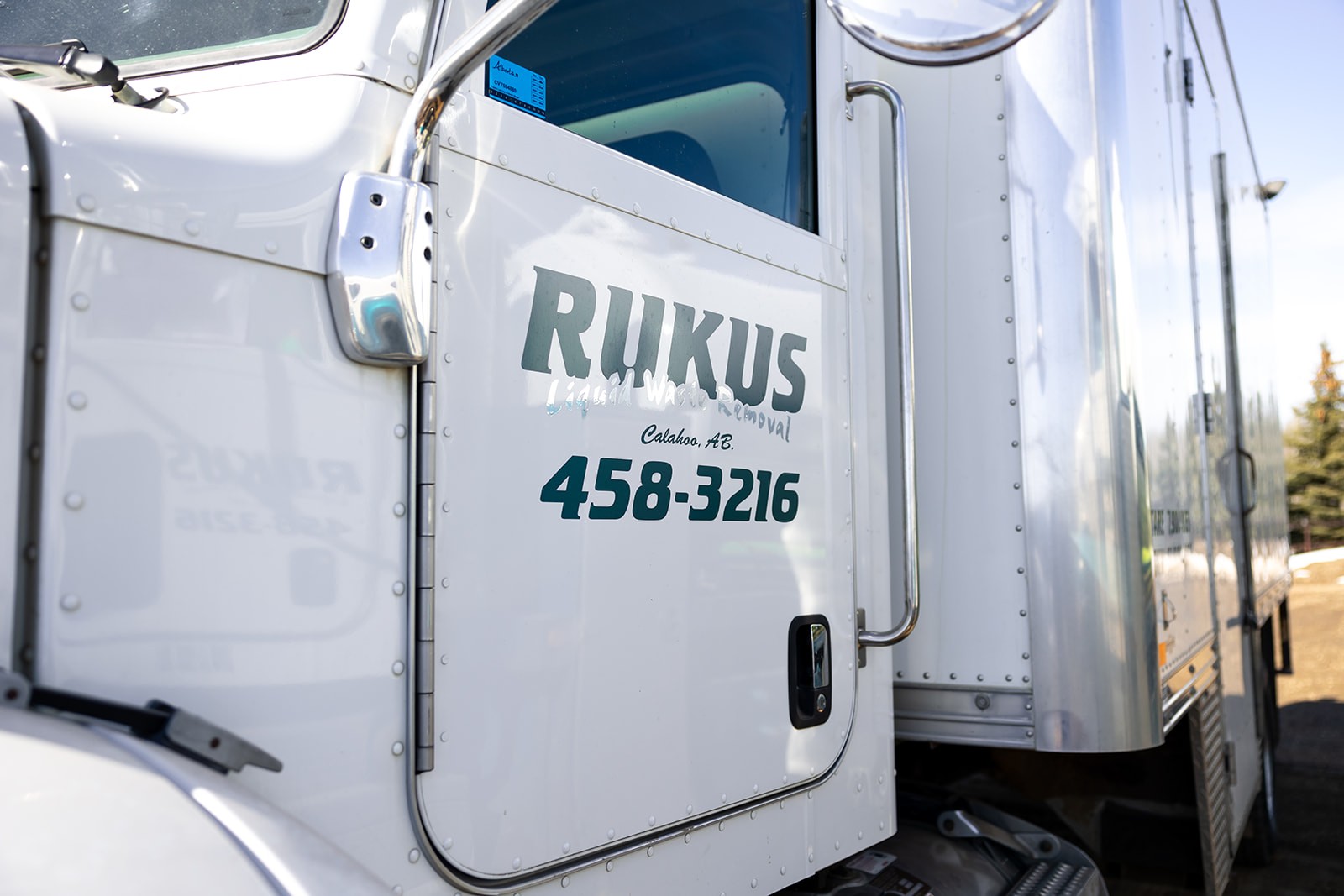 A steam truck edmonton image with rukus liquid waste truck