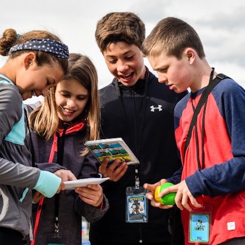 A group of kids playing a superhero city discovery game