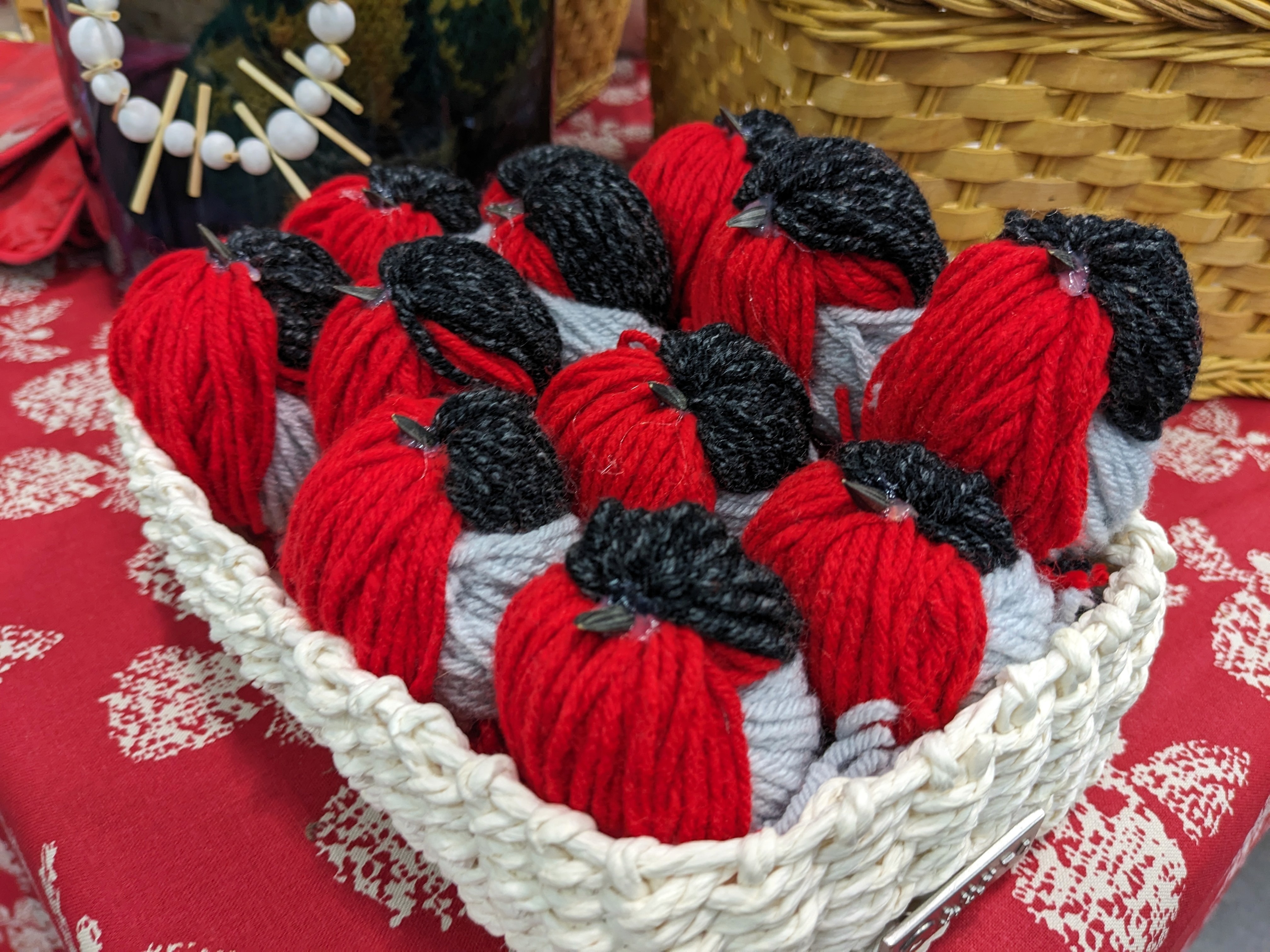 Product image of handmade bird ornaments made of yarn.