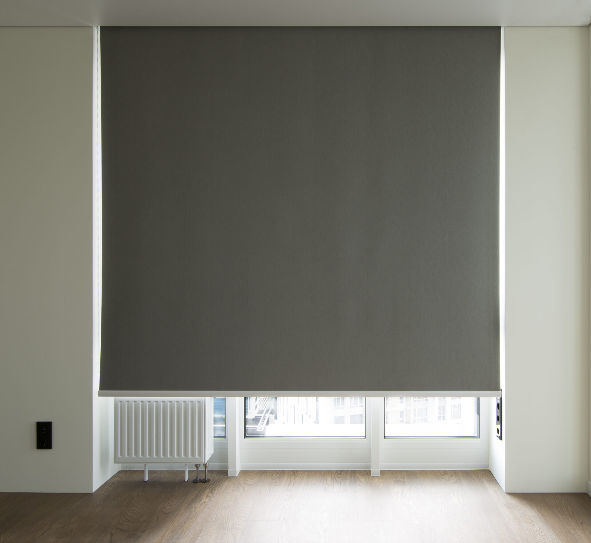 Gray Automated blackout roller shades for big windows in modern home. Wholesale Blind Factory