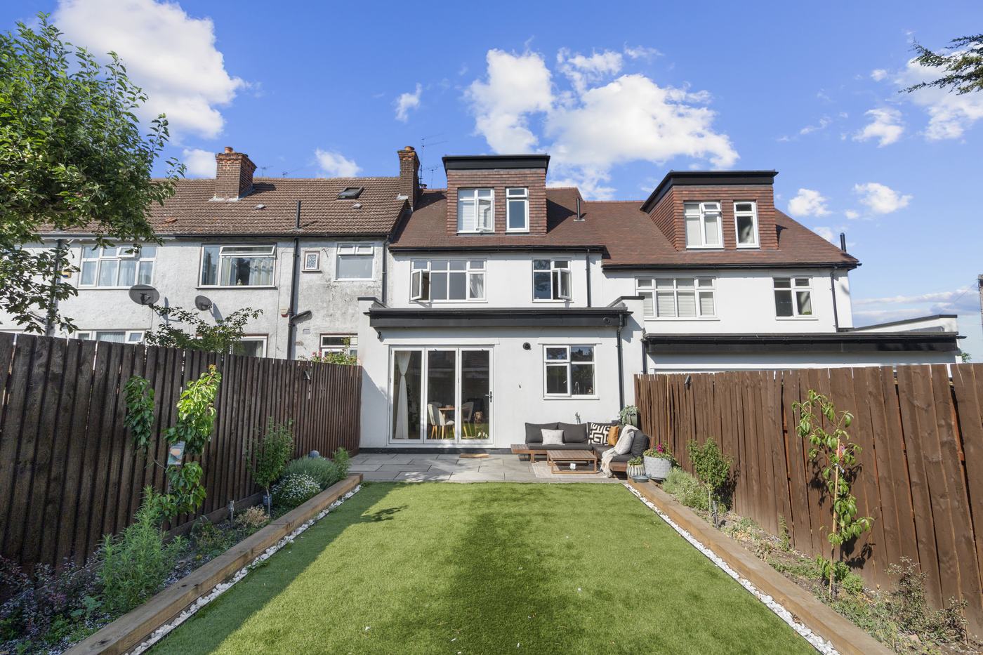 Rear exterior and private garden of a renovated High Barnet short-let property