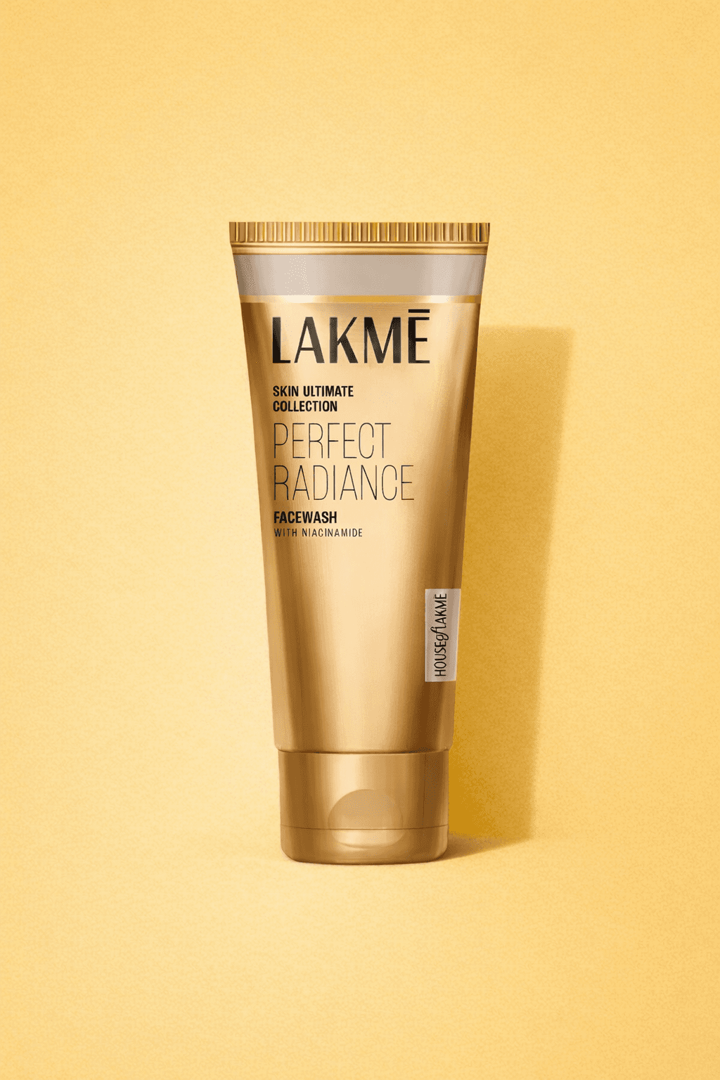 Close-up of a dark green leaf showing its textured surface and central vein against a muted background.