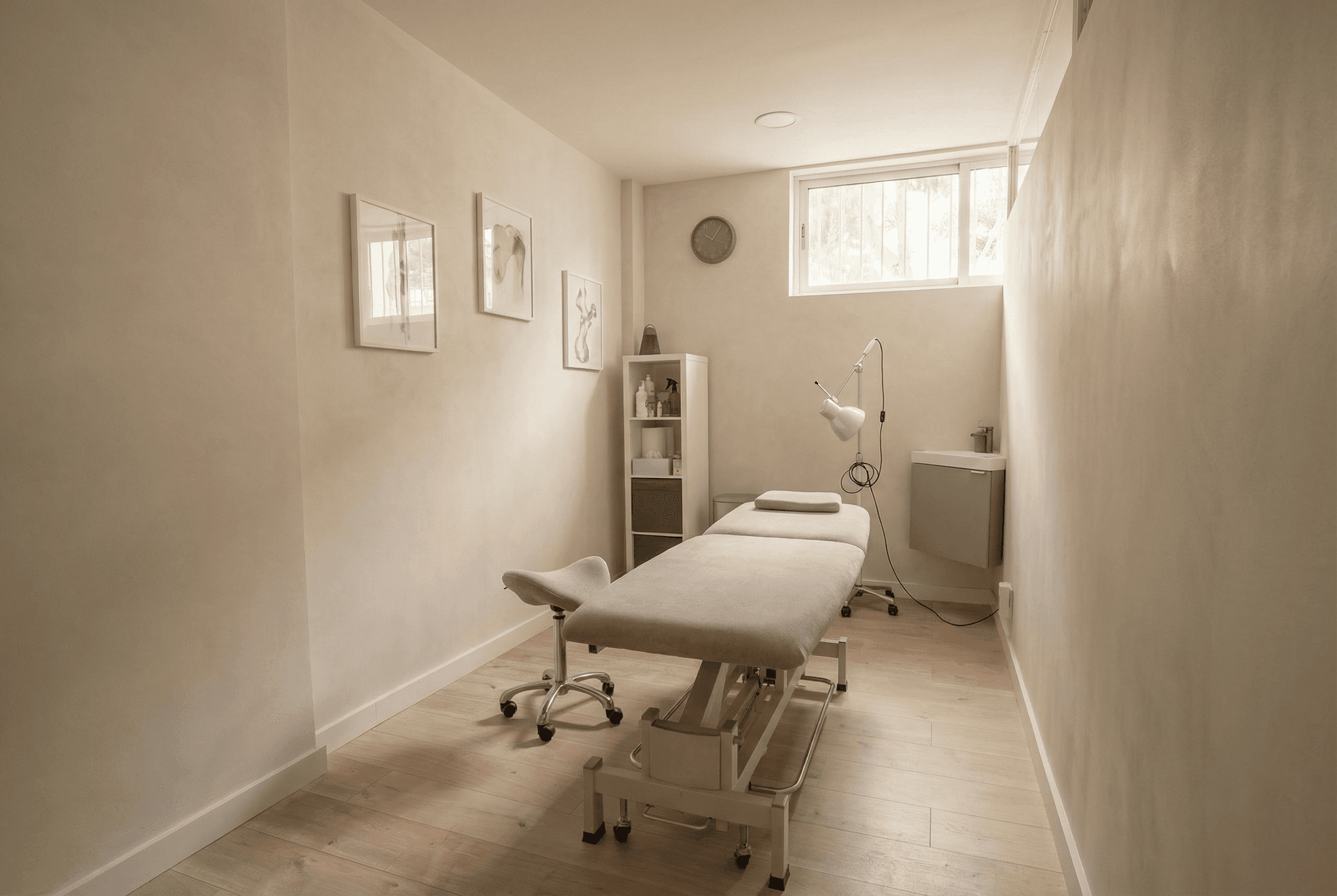 A luxurious indoor pool area with a panoramic view of a city at sunset. Comfortable lounge beds with soft fabrics surround the pool, while warm ambient lighting enhances the sophisticated atmosphere. The space combines modern elegance with a tranquil vibe.