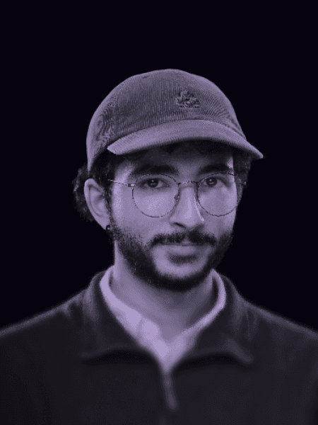 Professional portrait of person on a modern purple gradient background, business headshot for digital branding and team profile.