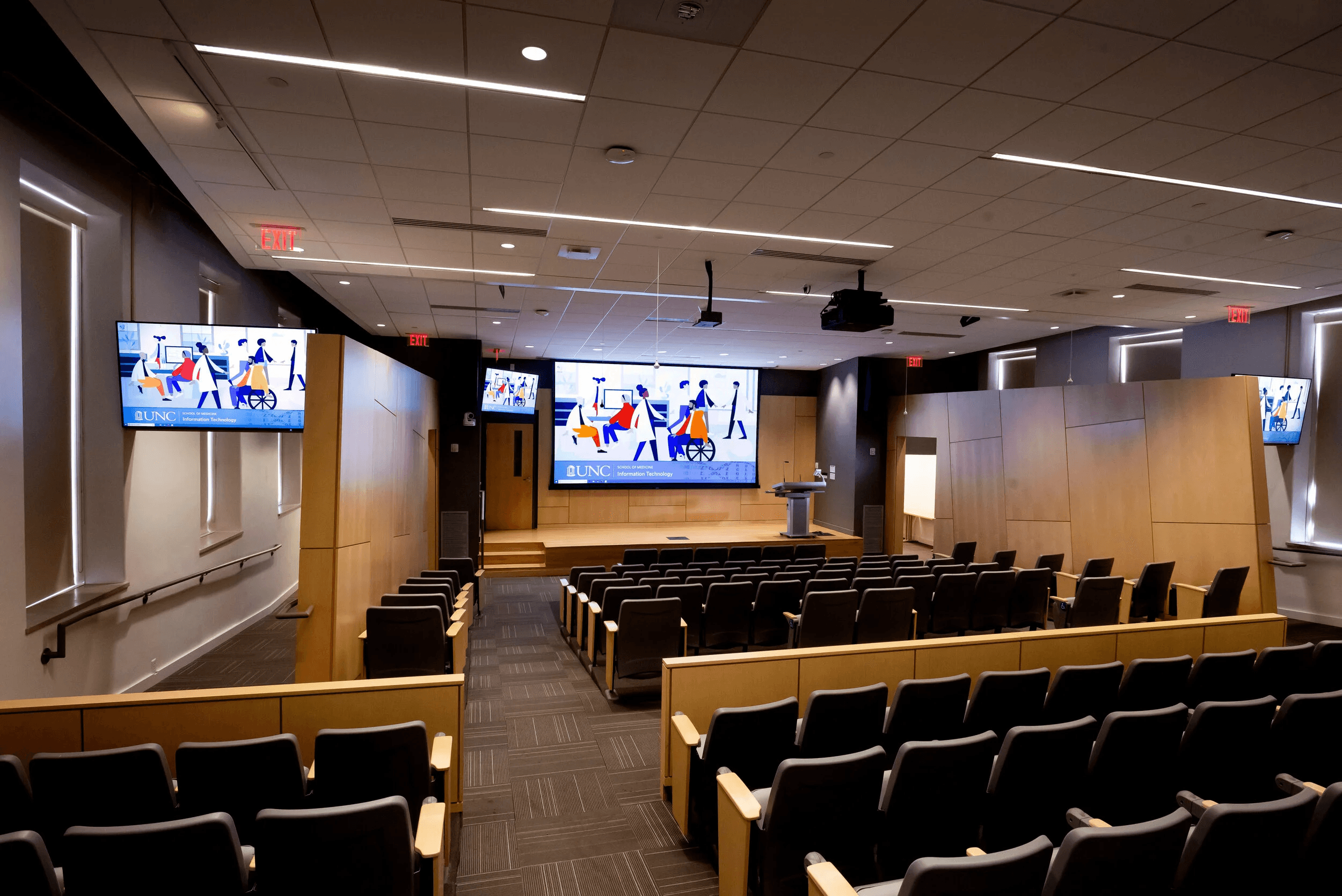 people sitting on chairs watching a game