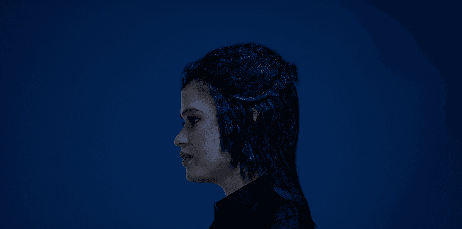 Close-up of white fur with black heart-shaped spots—soft, high-contrast texture for fashion/home décor.