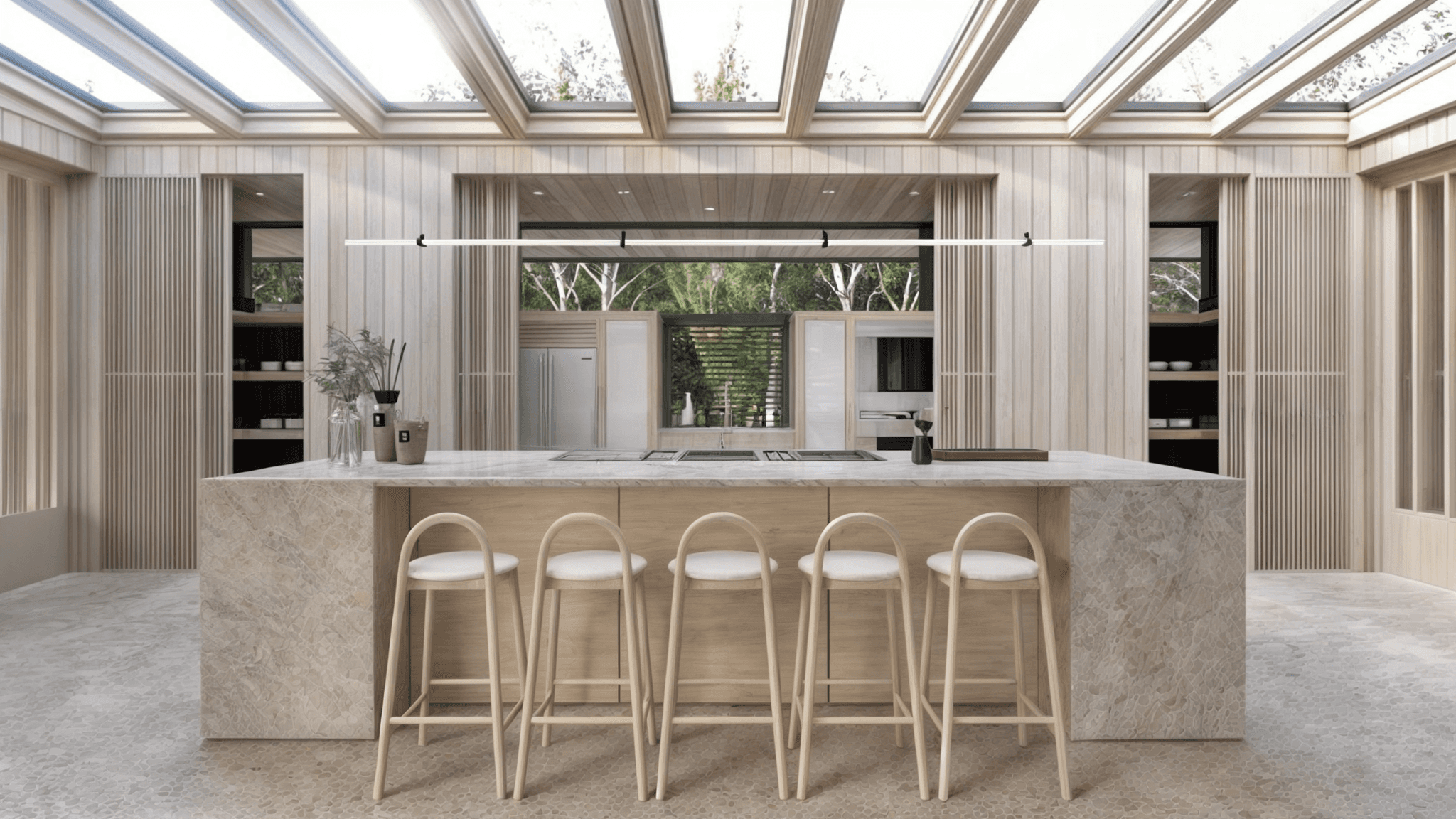 japandi Keukenontwerp met zichtbare houten balkconstructie en lange eettafel onder daklicht.